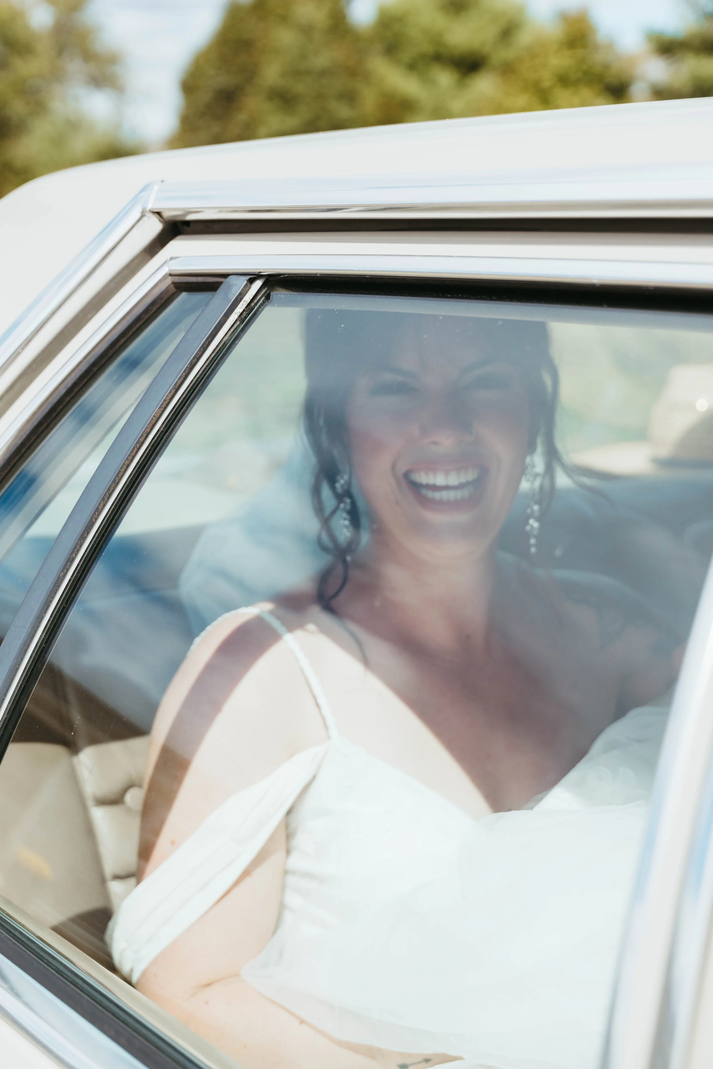 bride-in-old-car-outdoor-yurt-wedding.jpg