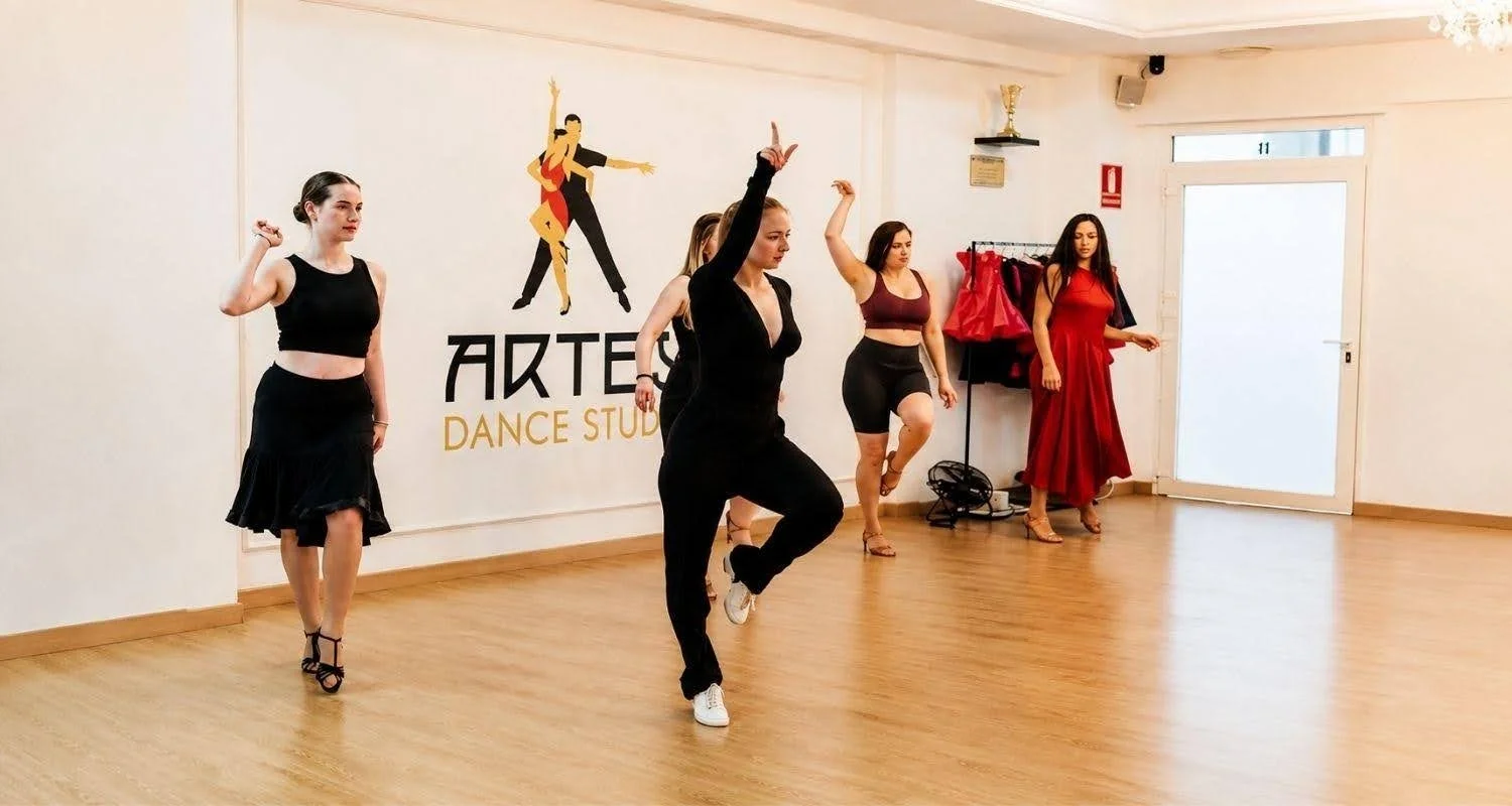 Students practising Latin dance styling in a group class at ARTEM dance studio in Marbella