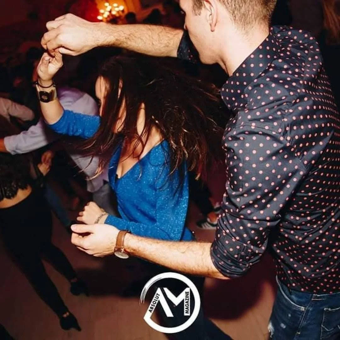 Private dance lessons with a couple dancing together in a lively social setting