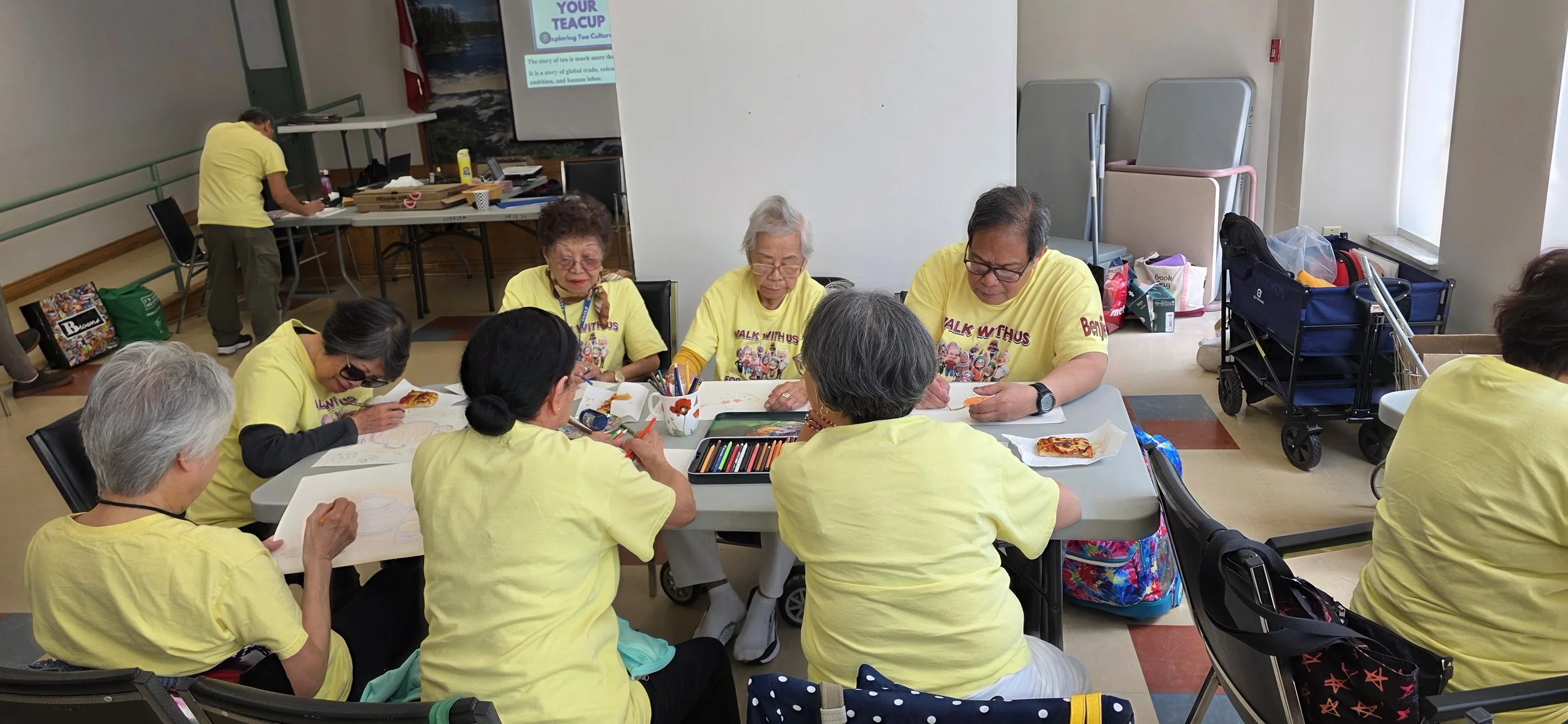 Seniors group creating art based on the Tea lecture.