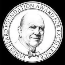 Black and white logo of the Lambeard Foundation Award for Excellence featuring a portrait of a distinguished older man with a bald head, wearing a bowtie, encircled by the award's name.