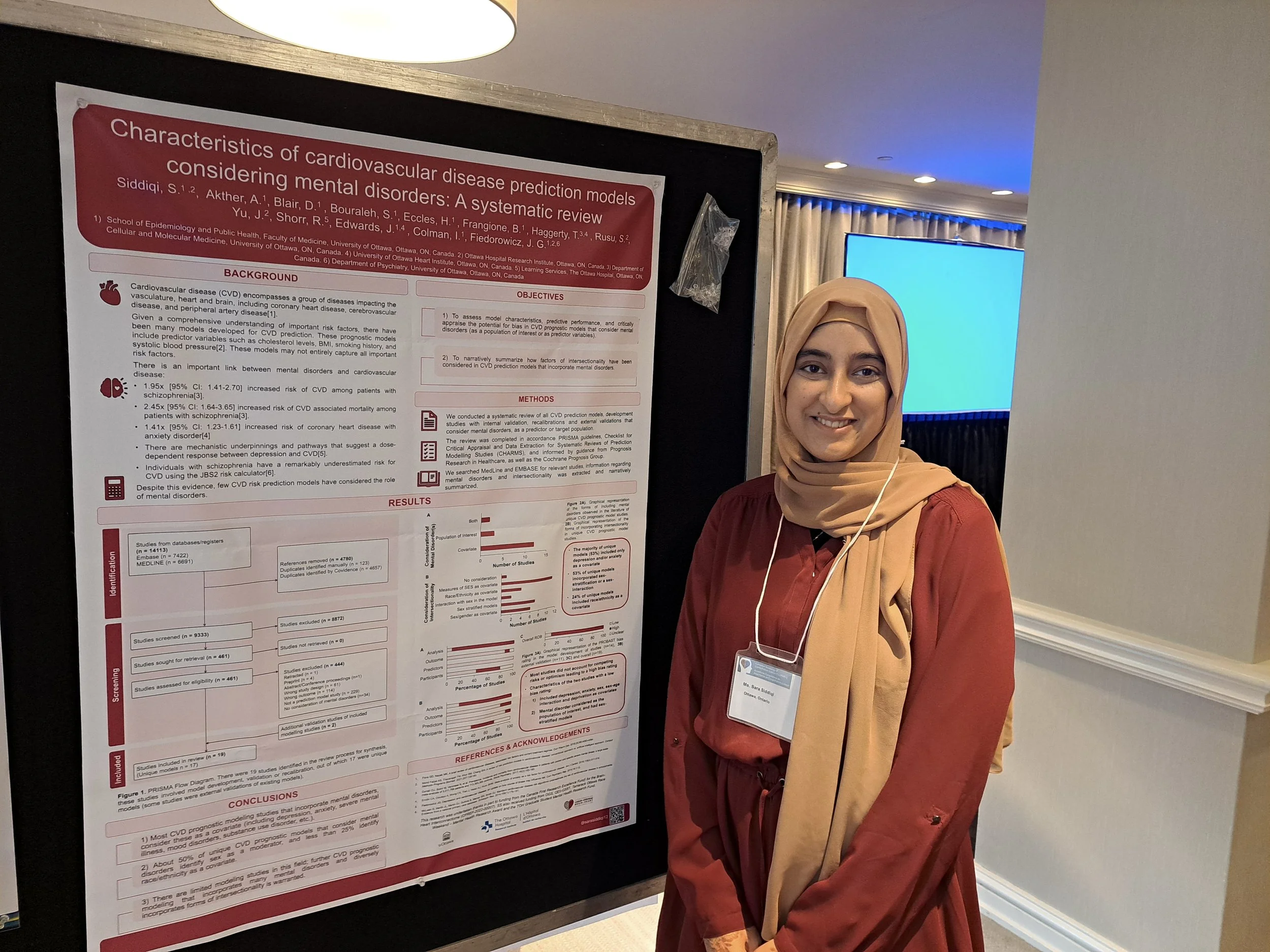 Sara Siddiqi with presentation board