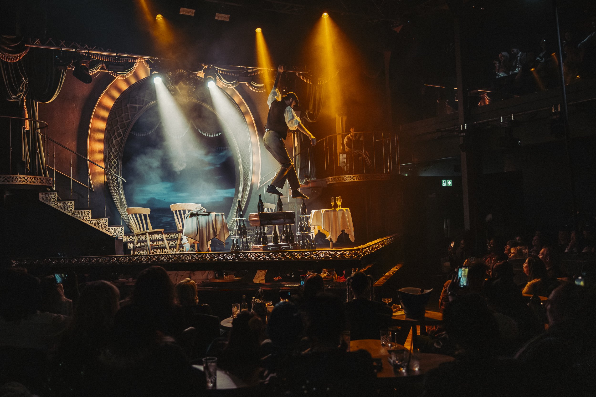High wire and bottle walker Ellis Grover, of the Take That tour, performs in a David Bowie space suit at the Brit Awards 2026, programmed and choreographed by Secret Productions.