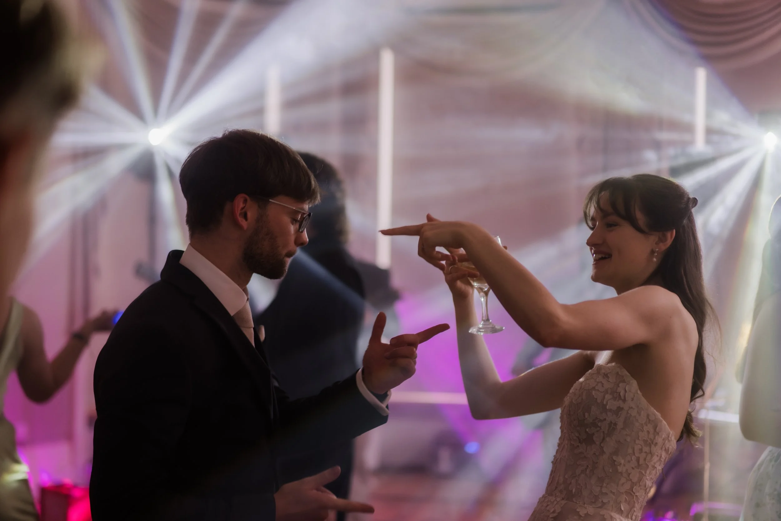 Bride and groom dancing ambient DJ lights Gloucestershire 