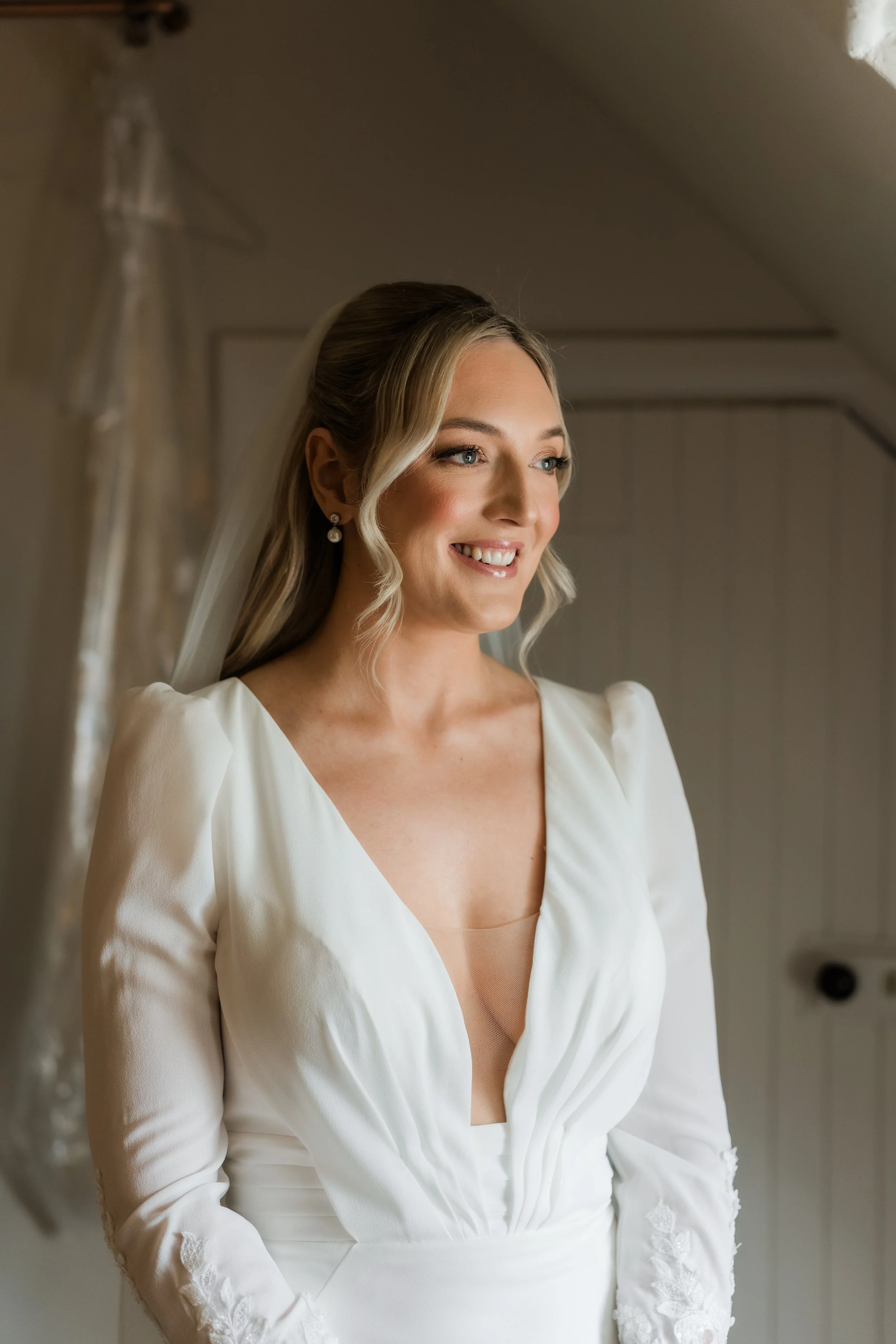 Candid bridal portrait in natural light at Charlton Hall, captured in a quiet moment before the ceremony