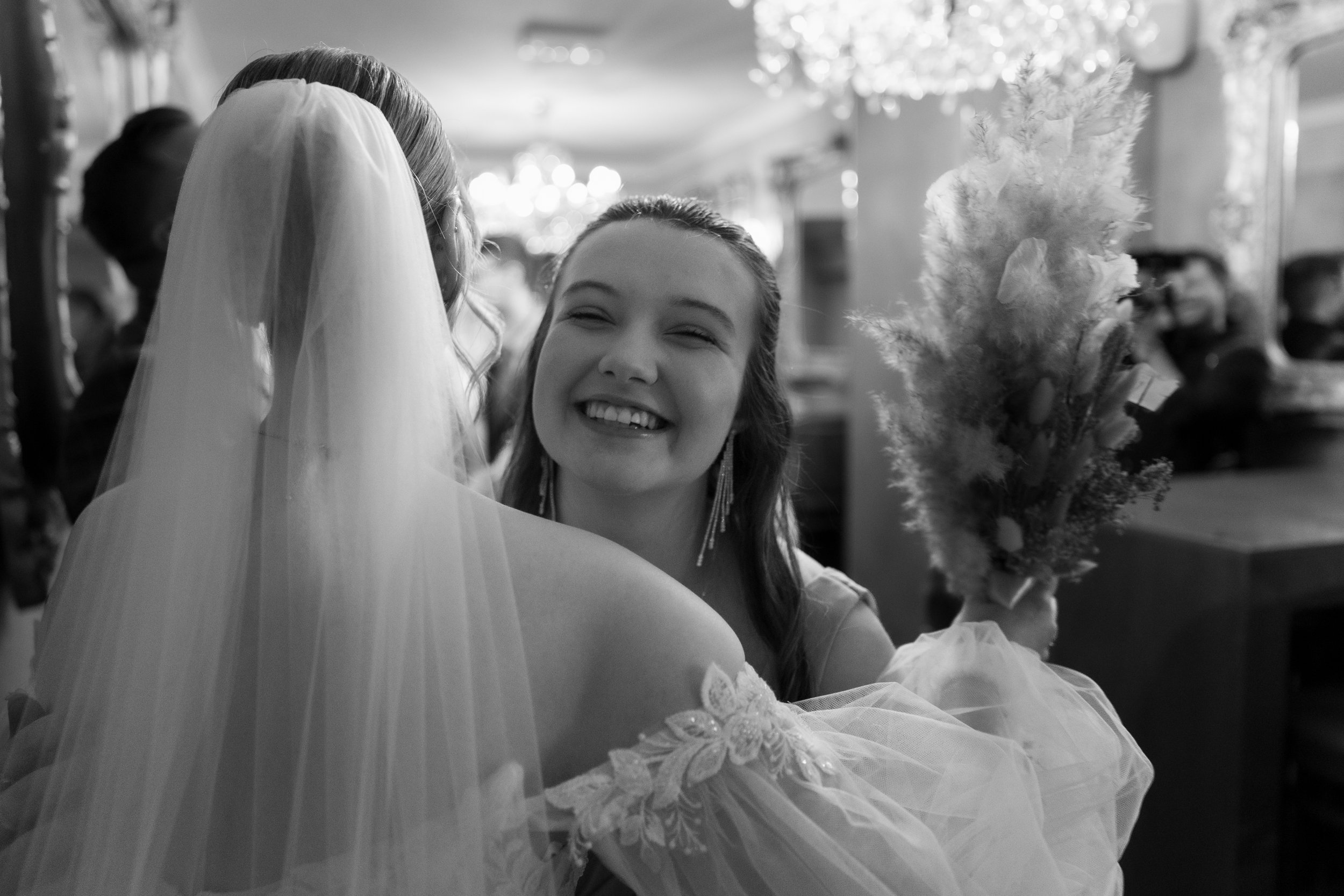 L&J Wedding Photography and Videography. bridesmaid hugging bride. Yorkshire wedding. Fine art. Natural beautiful.
