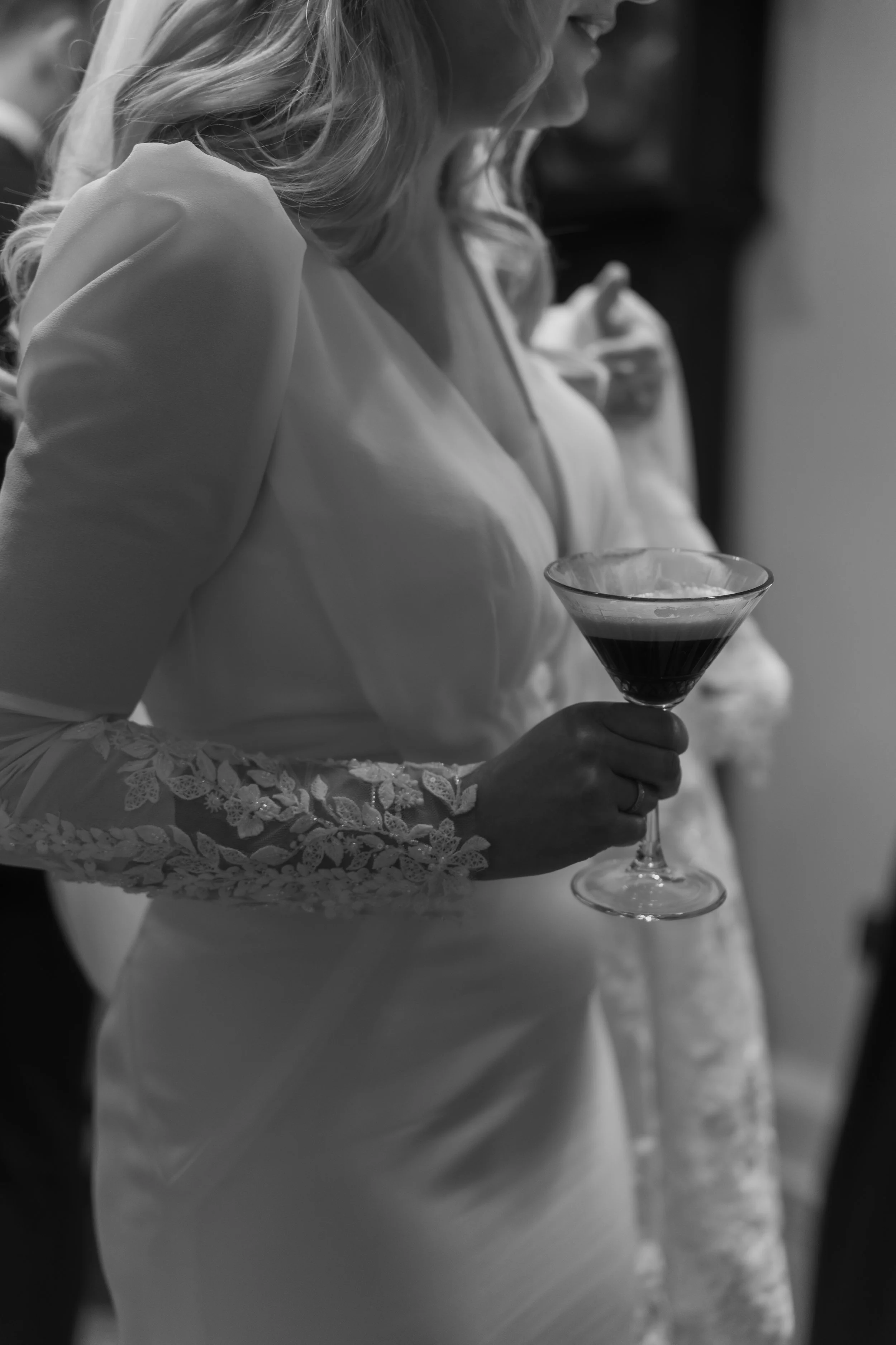 Bride holds espresso martini. Black and white. Northumberland. Charlton Hall