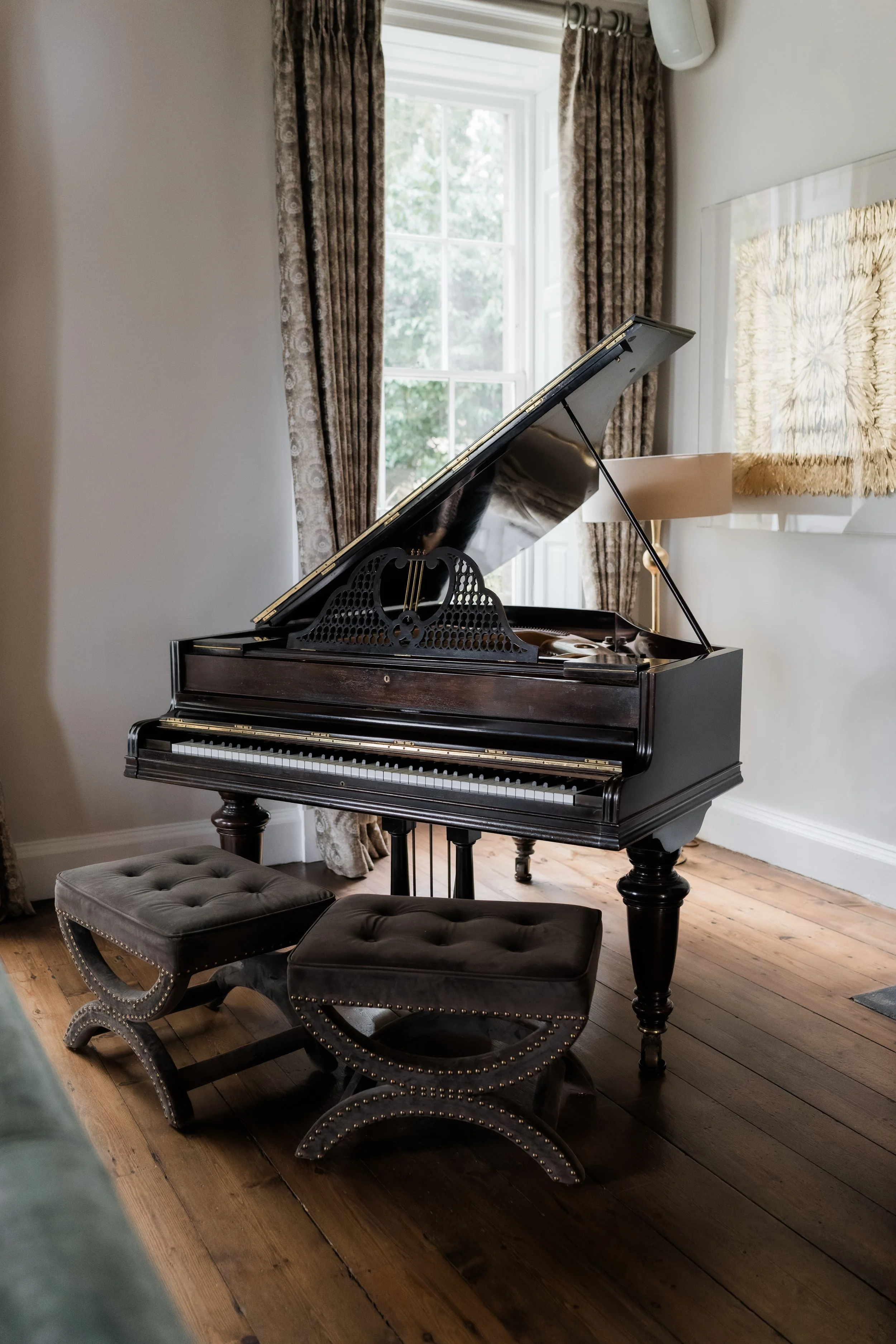 Elegant interior detail with a grand piano at Charlton Hall wedding venue, styled with refined décor