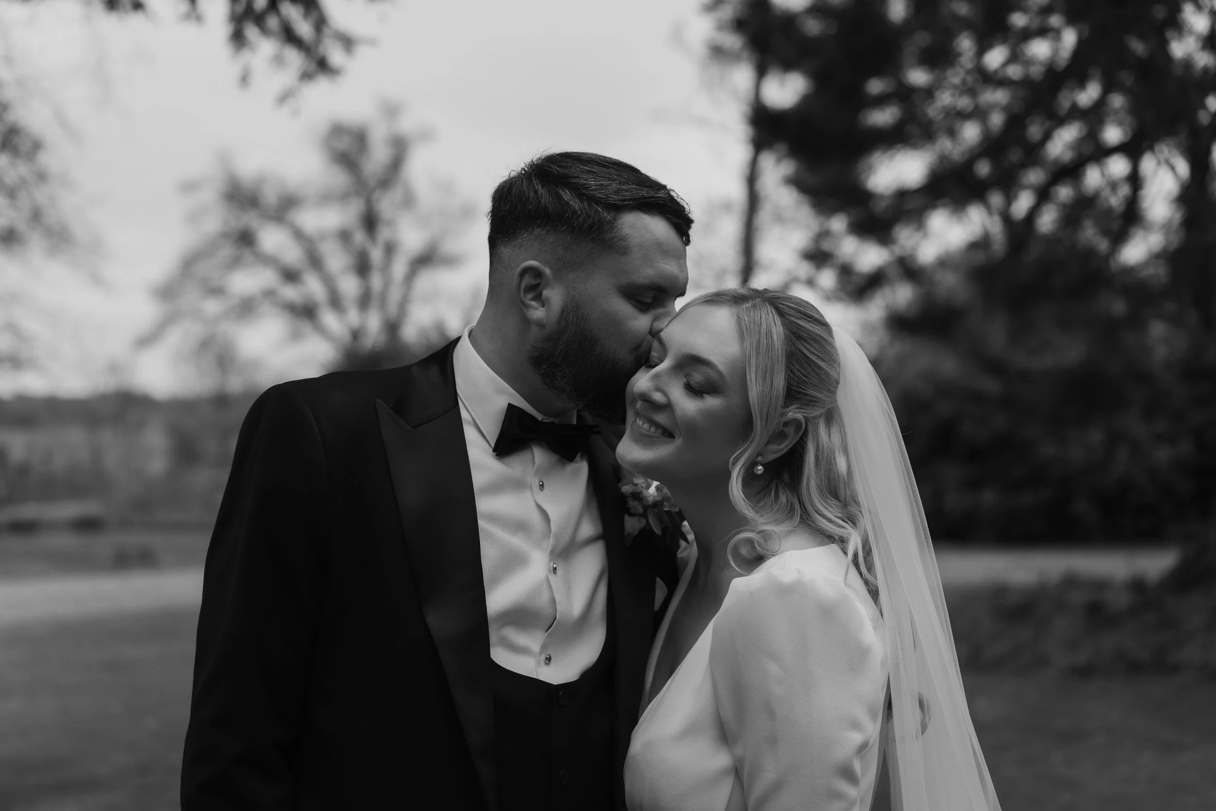Editorial-style wedding portraits captured in a documentary way, with the couple exploring the grounds of Charlton Hall
