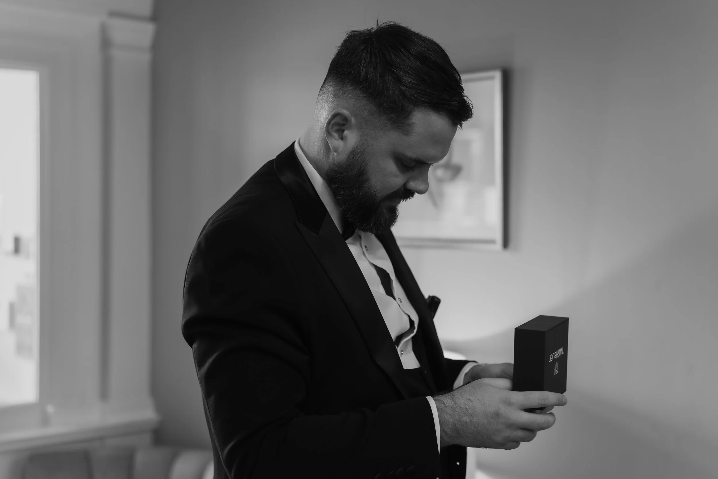 Groom opens gift from bride morning of wedding tag heuer