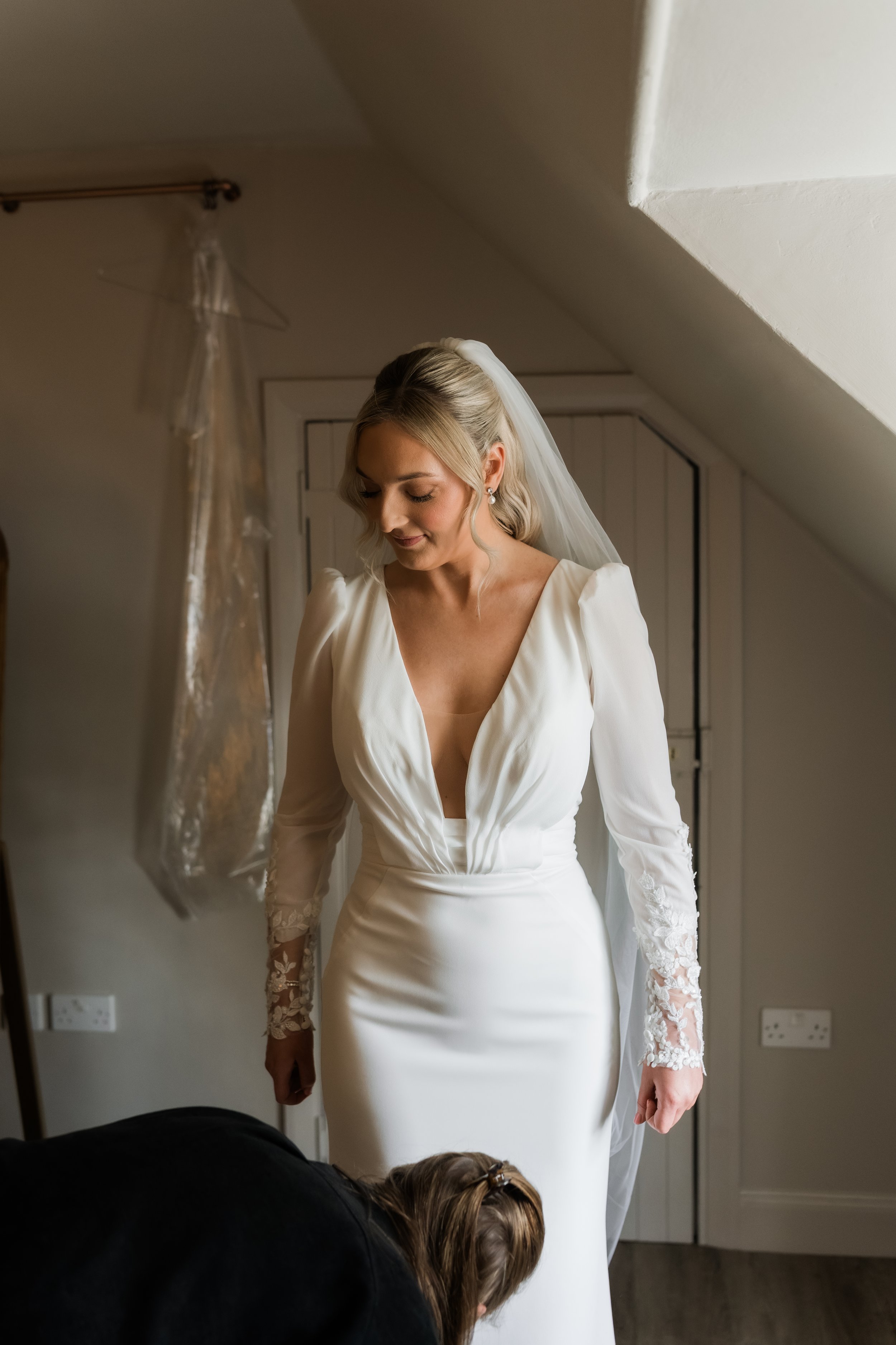 Candid bridal portrait in natural light at Charlton Hall, captured in a quiet moment before the ceremony