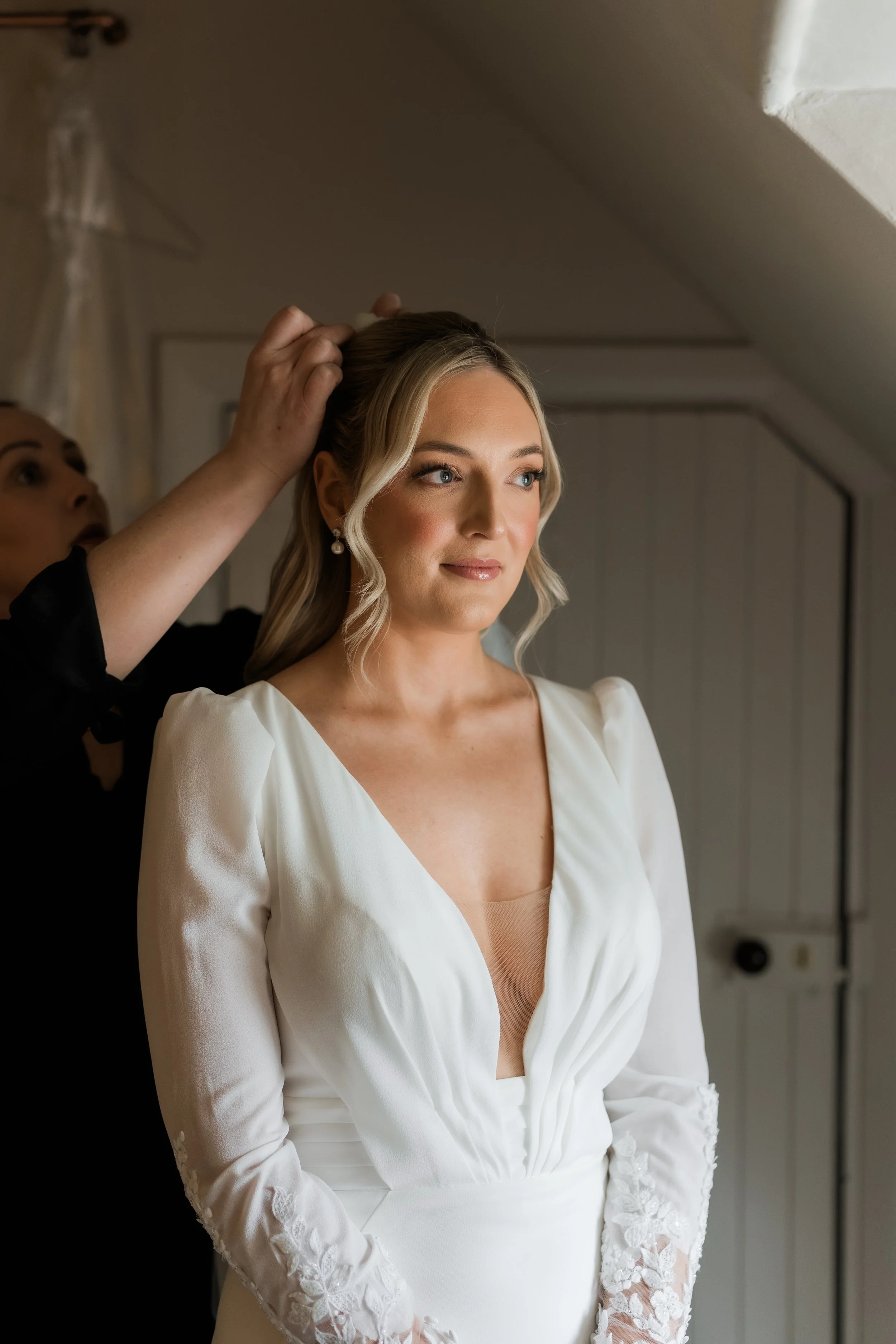 Candid bridal portrait in natural light at Charlton Hall, captured in a quiet moment before the ceremony