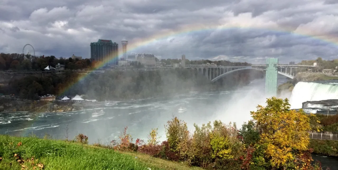 A rainbow over the Rainbow Bridge from New York to Canada at Niagara Falls