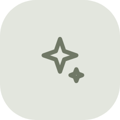 Simple icon of a sparkling star with a smaller star next to it on a light background.