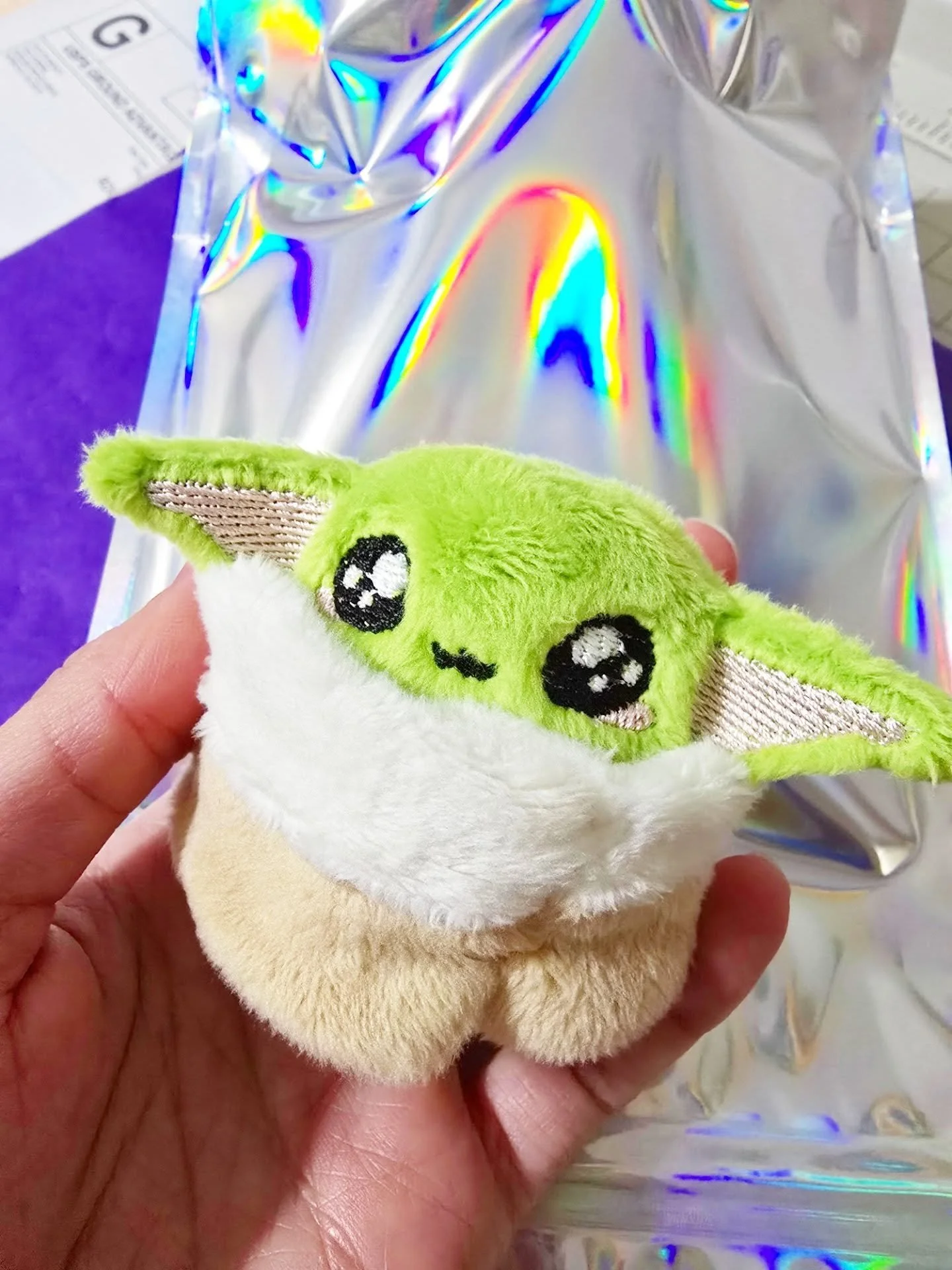 Packaging a baby green boi handmade miniature plush 💚