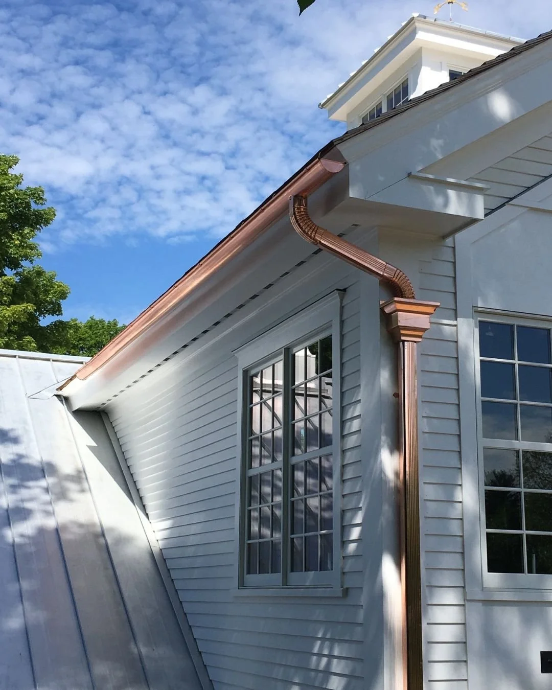 Nothing elevates a home's exterior quite like custom copper half-round gutters paired with decorative leader heads. 

At Legacy Gutter, we take pride in installing custom gutter systems that are as functional as they are beautiful. Every detail matte