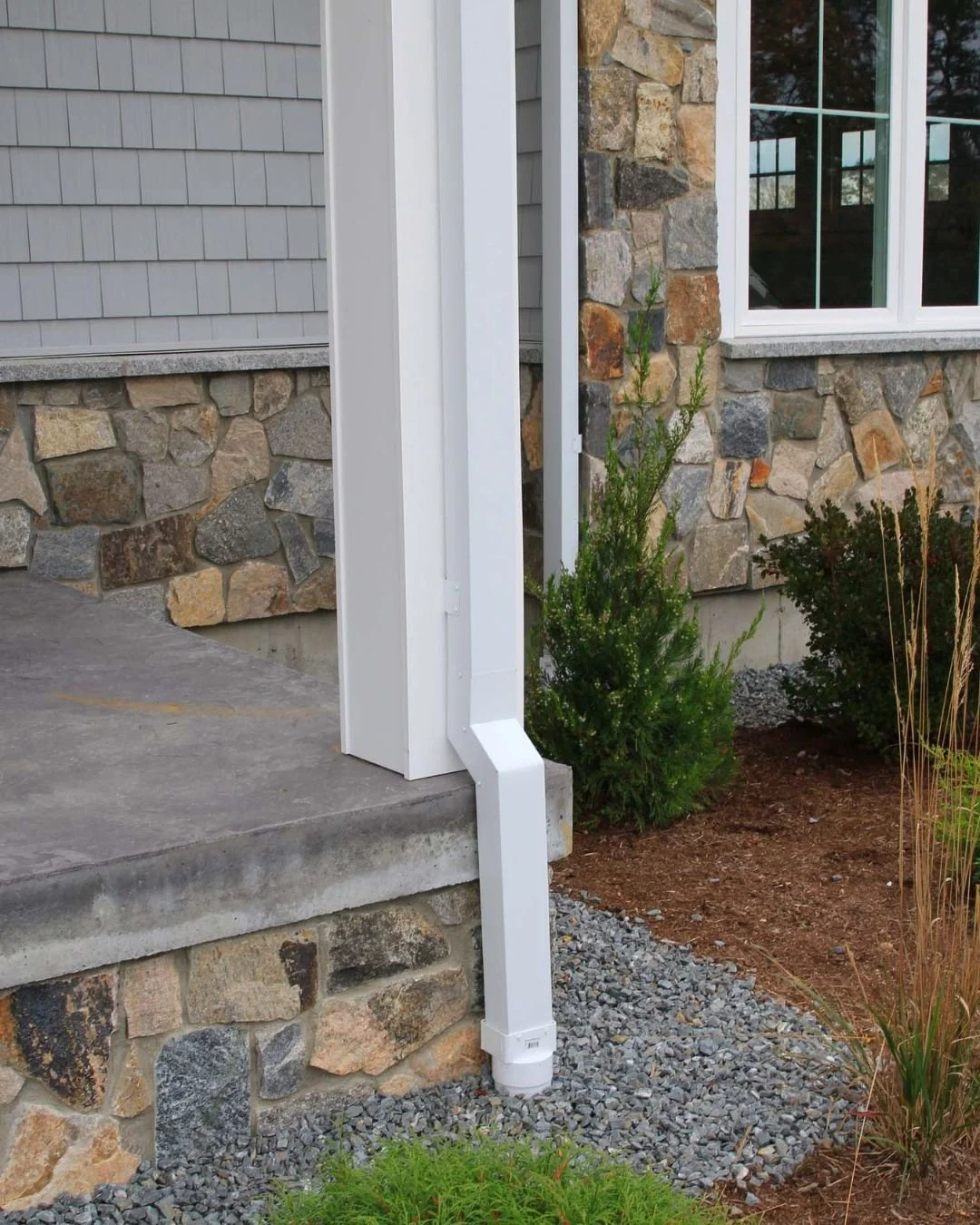 Sunny afternoon, frozen night. Repeat. ❄️

That's how a downspout freezes solid in a New Hampshire winter. Meltwater runs down from the roof, the temperature drops, and whatever is left in the pipe turns to ice. Once it's blocked, water backs up, gut