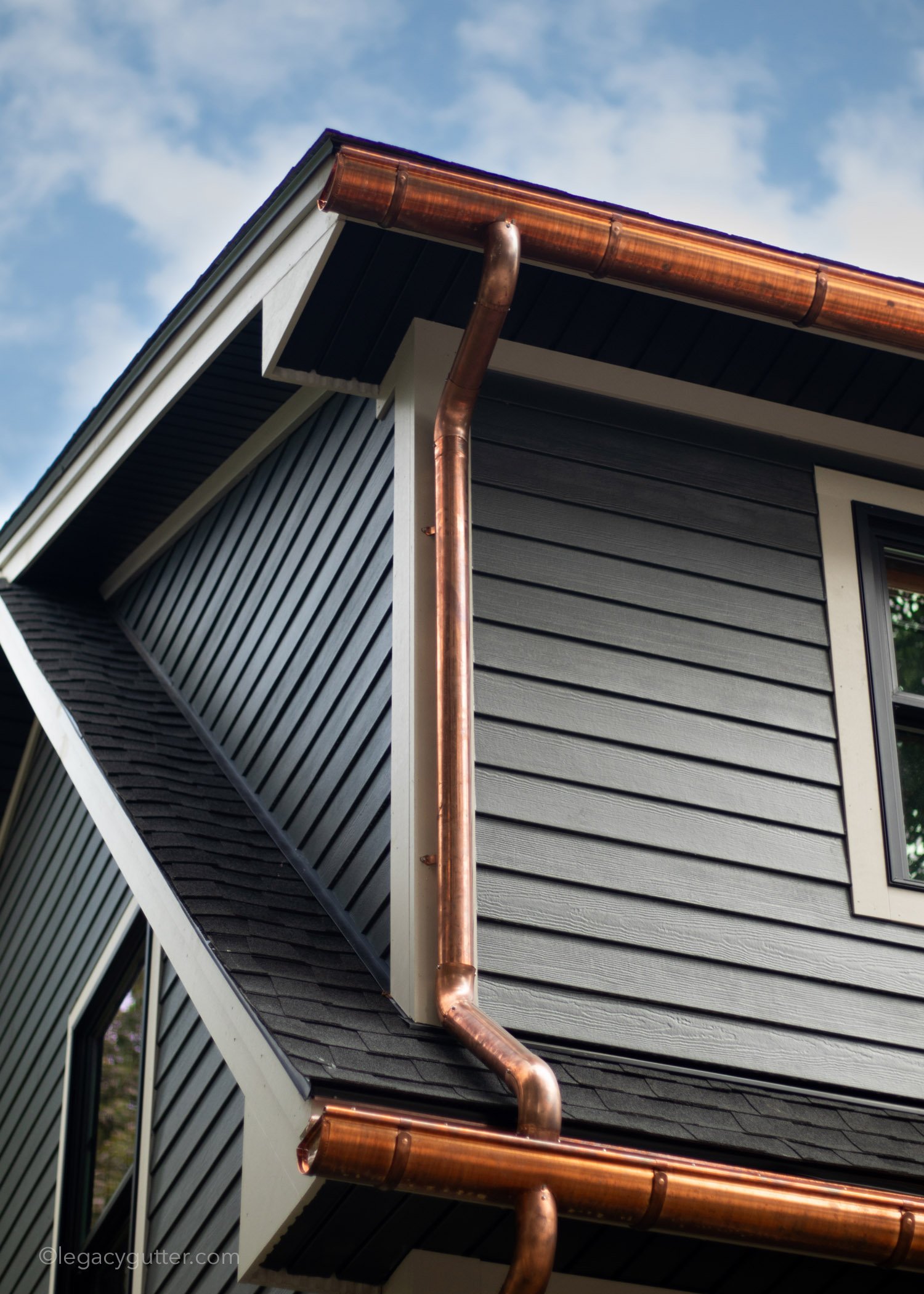 Gutter Cleaning in Canterbury, NH removing leaves and buildup from a residential gutter system