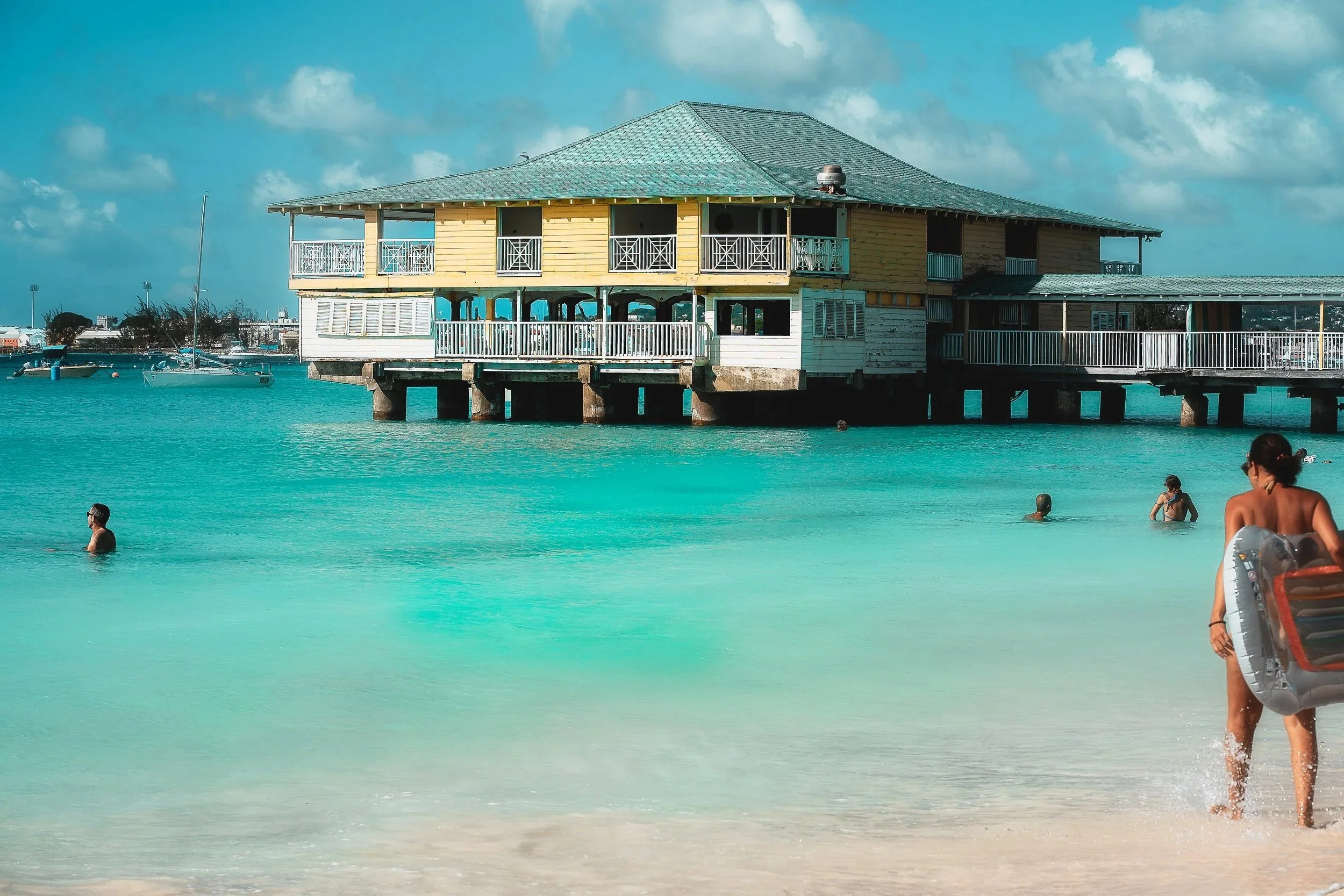 TRAVEL+Pebbles+Beach+w+Pier+High+File+BARBADOS+2026.jpg