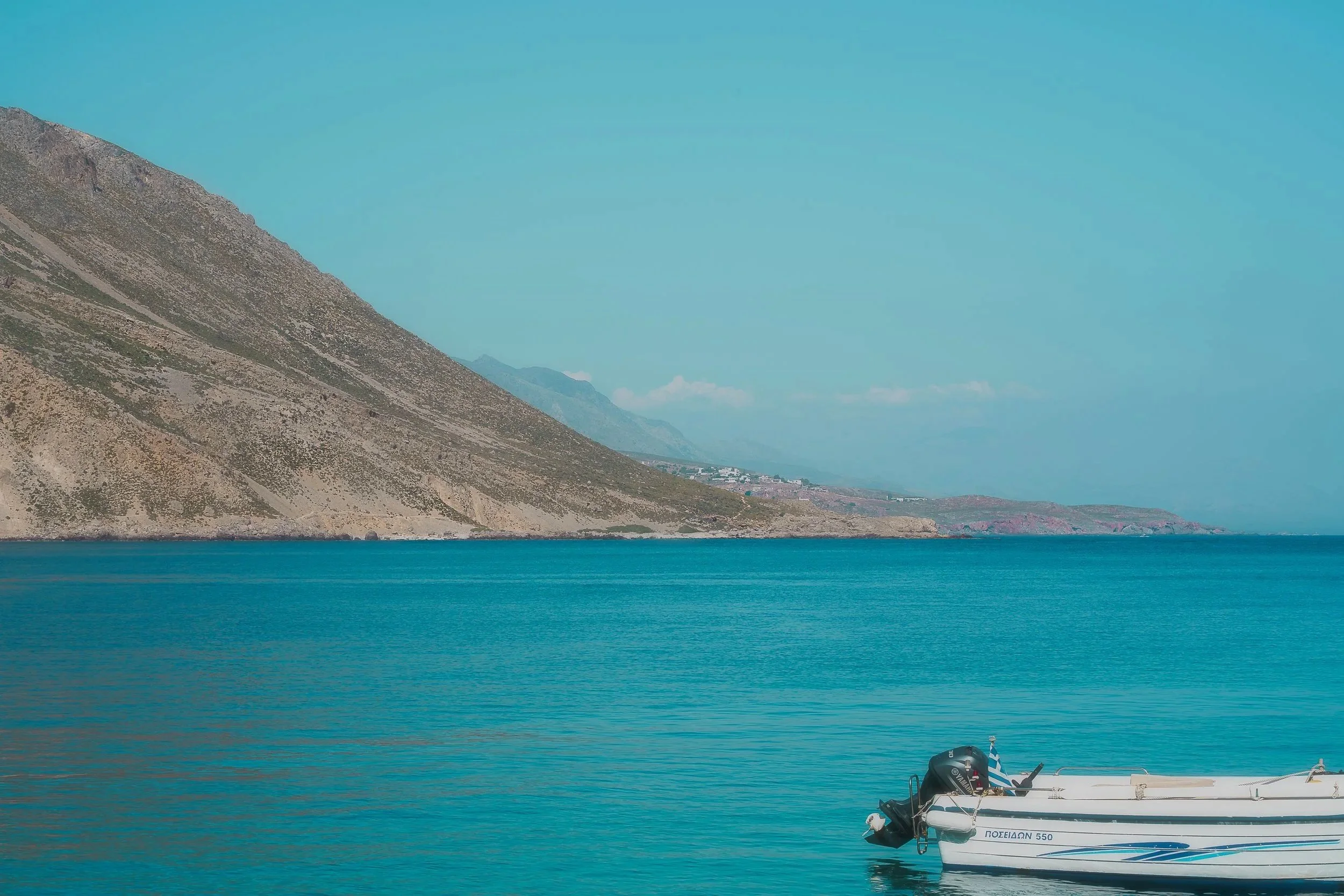 TRAVEL+Loutro+Hills+w+Boat+GREECE+2022.jpg