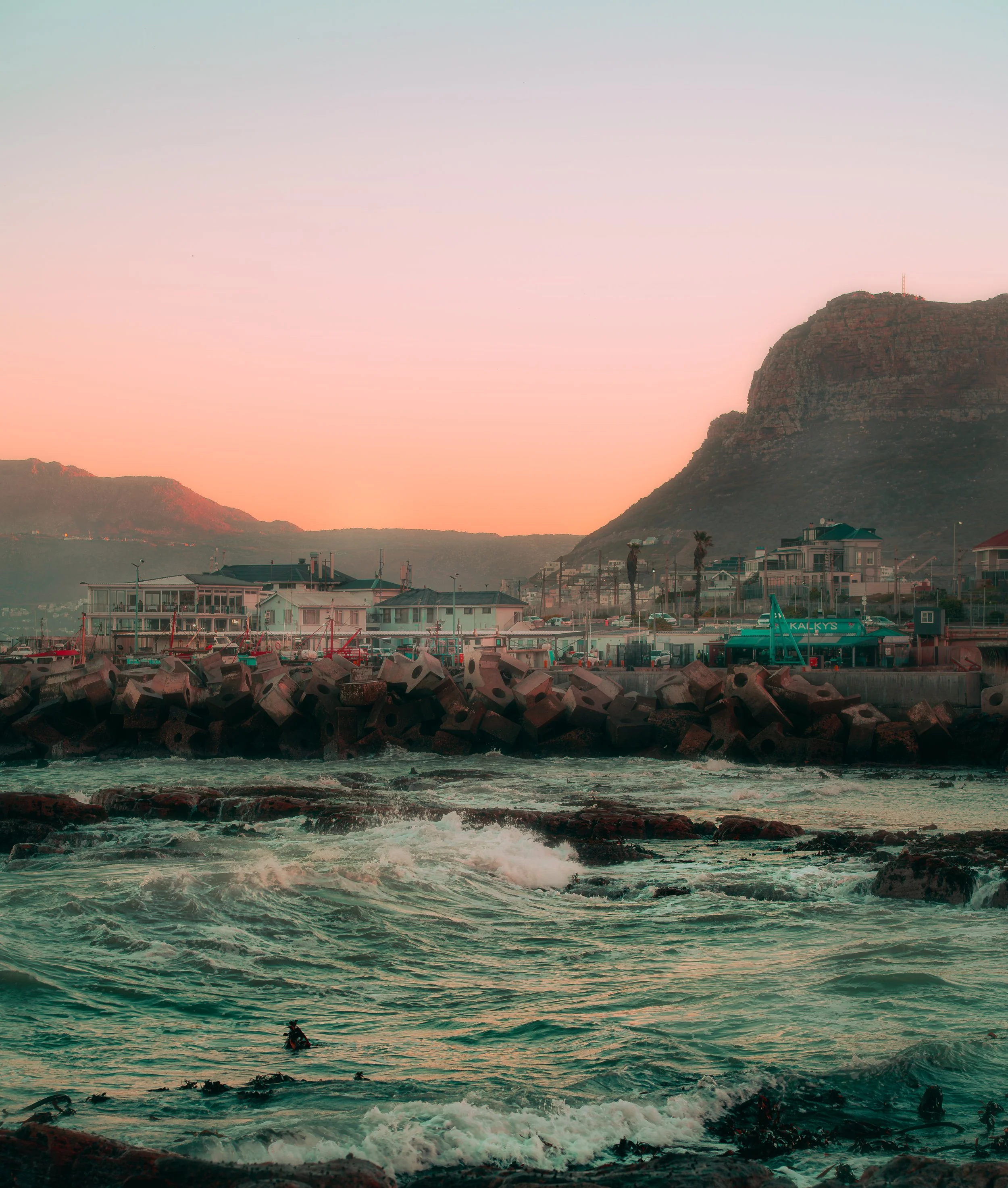 TRAVEL Kalk Bay Surfer by Pier SOUTH AFRICA 2025.jpg