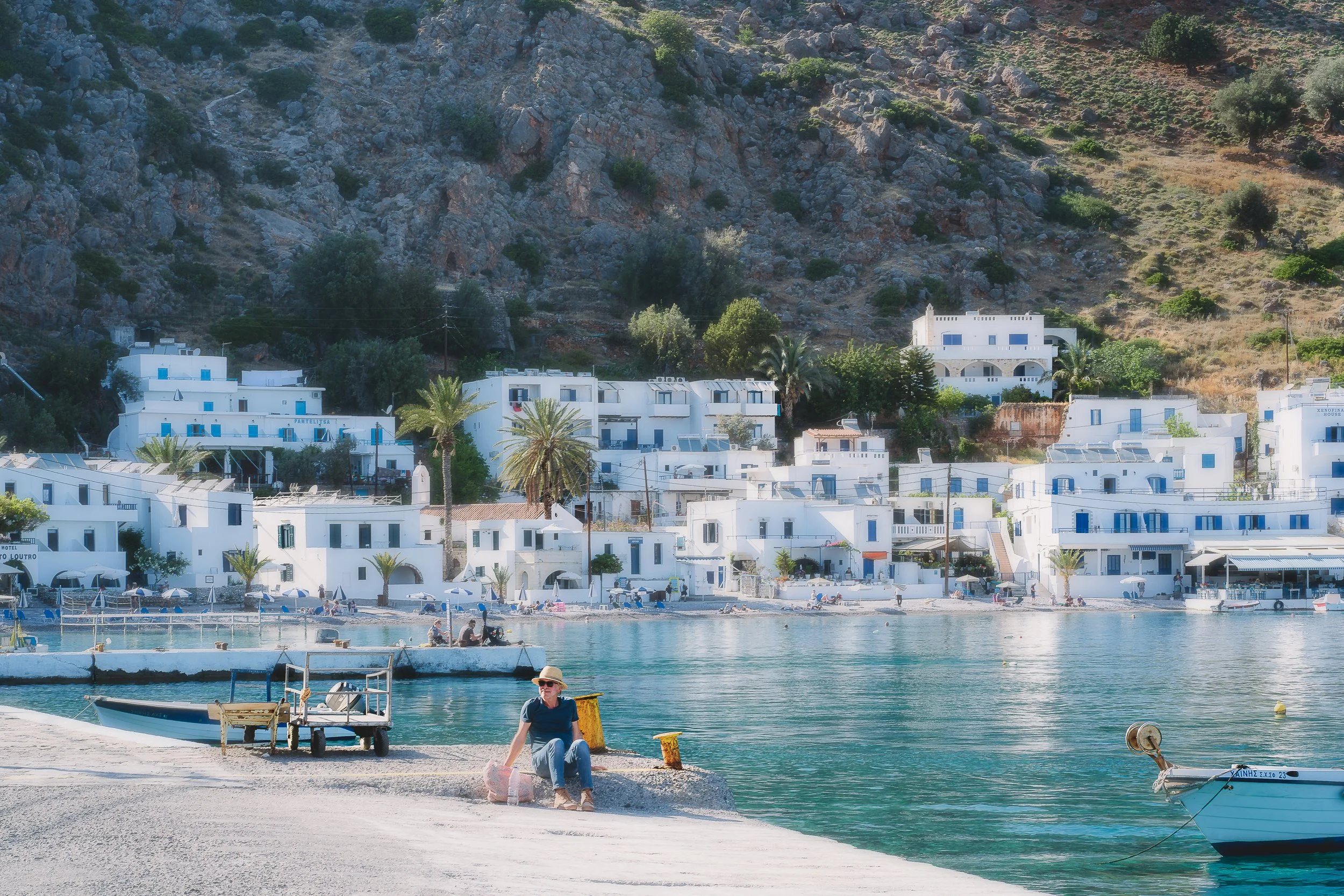 TRAVEL Loutro Man By Dock GREECE 2022.jpg
