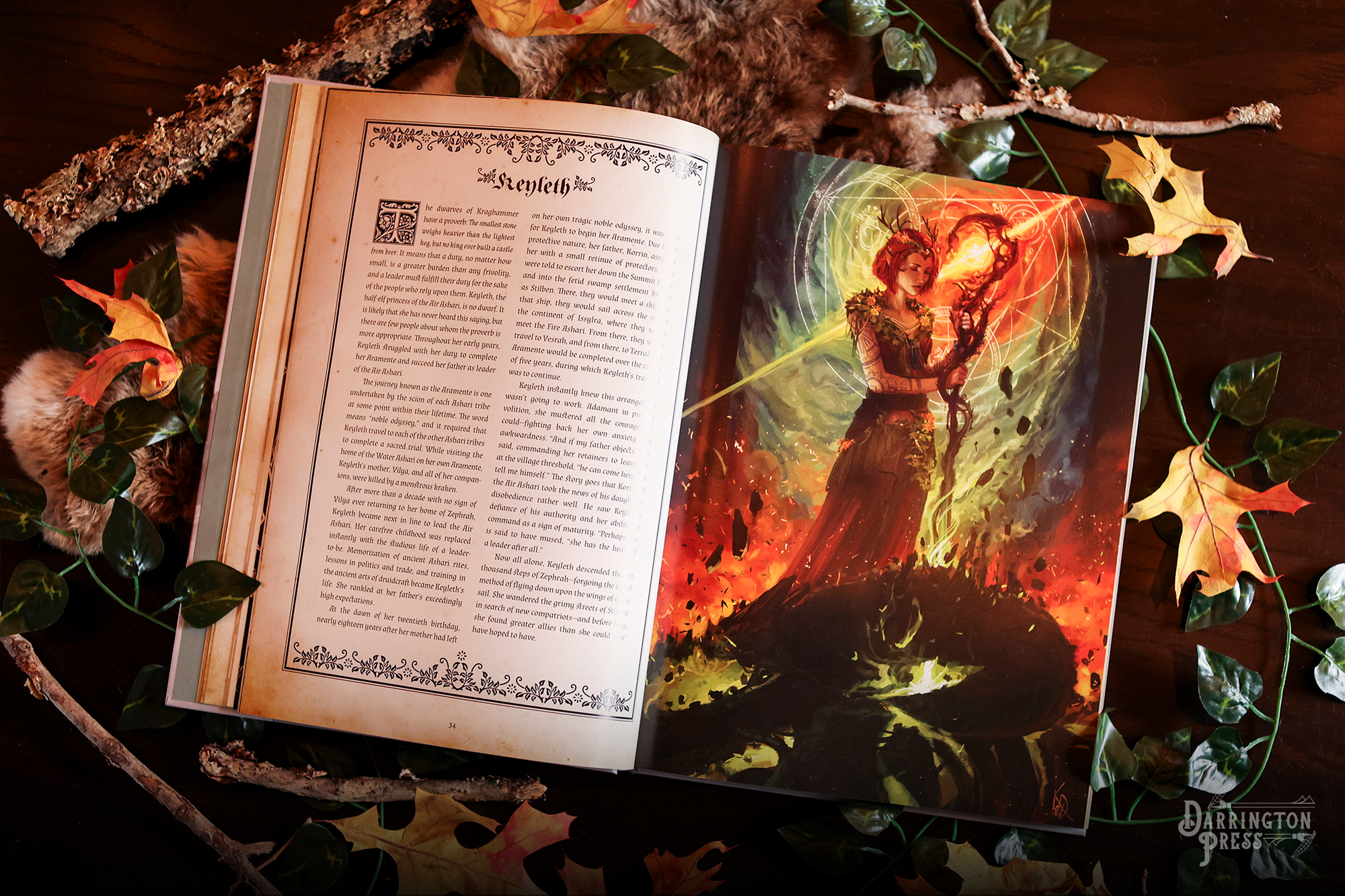 Open spread from Critical Role: The Chronicles of Exandria Vol. I: The Tale of Vox Machina, with Keyleth’s biography beside an illustration of Keyleth. She has red-haired, and is holding a glowing staff amid swirling green and orange magic.