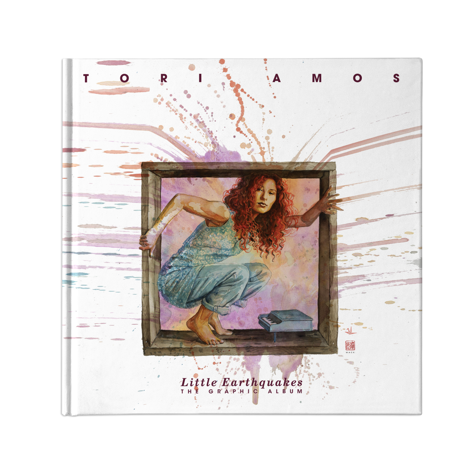 This book cover has the text  "Tori Amos" at the top & "Little Earthquakes The Graphic Album" on the bottom. The art is a watercolor of Tori Amos. She's wearing blue & is crouched in a wood box over a tiny piano. Watercolor splatters outwards.