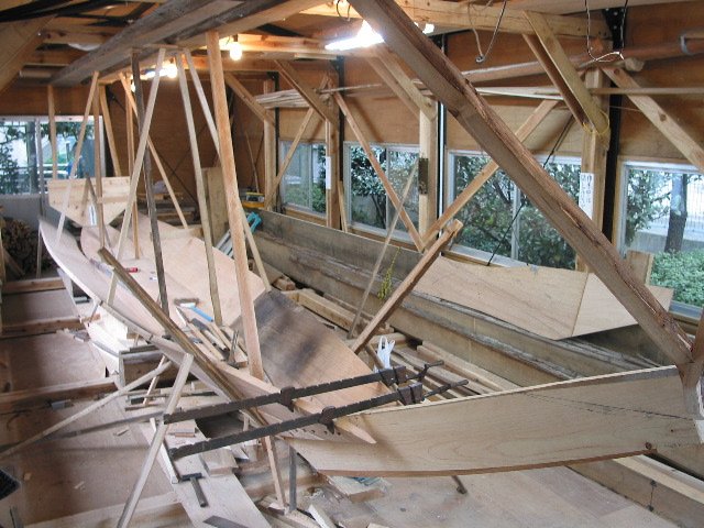 The first planks were bent over an open fire. You can see the charring in this photo.