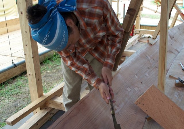 My apprentice Takumi Suzuki fitting first plank to the keel using a special saw.