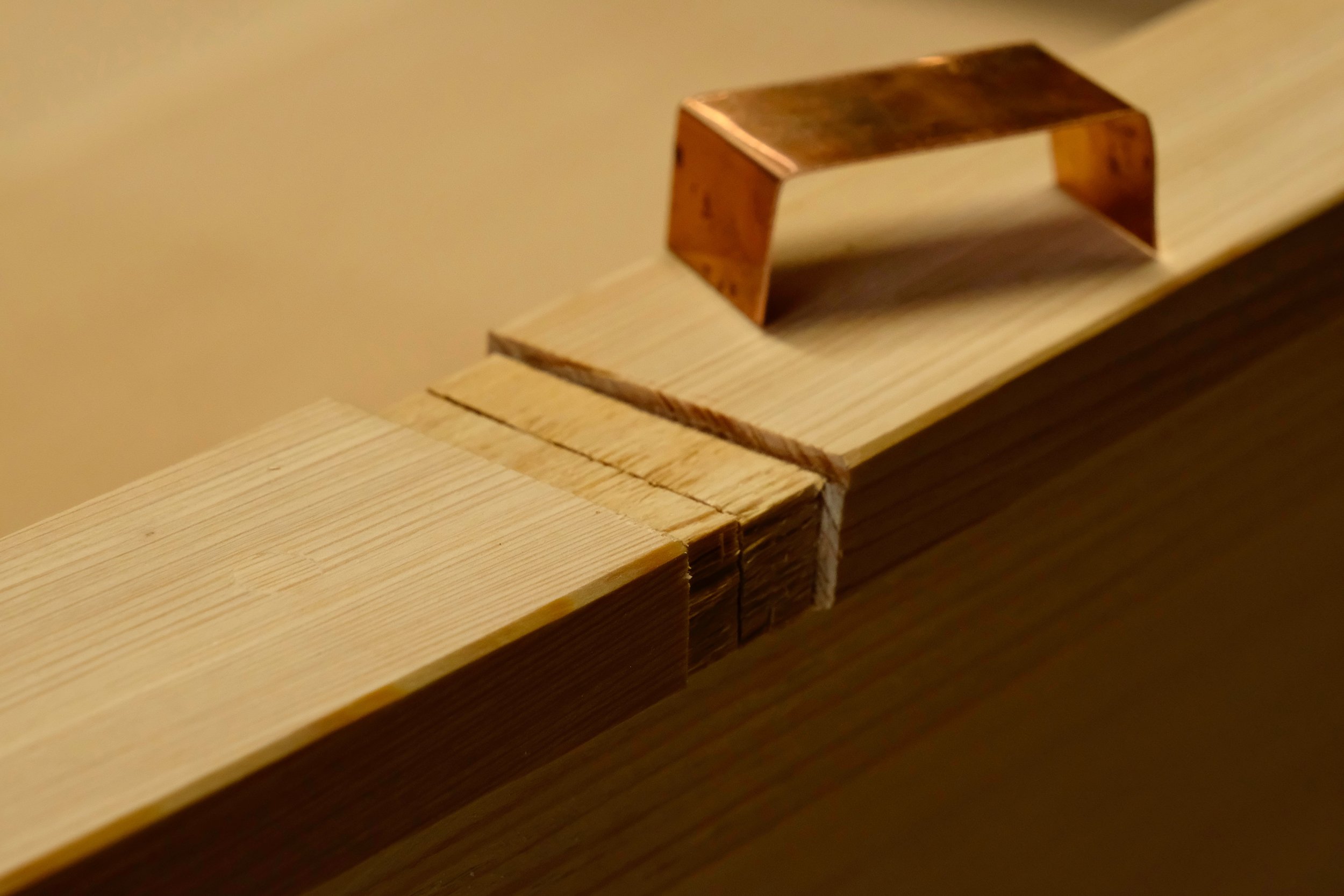 The simple joint in the caprail is covered with copper.