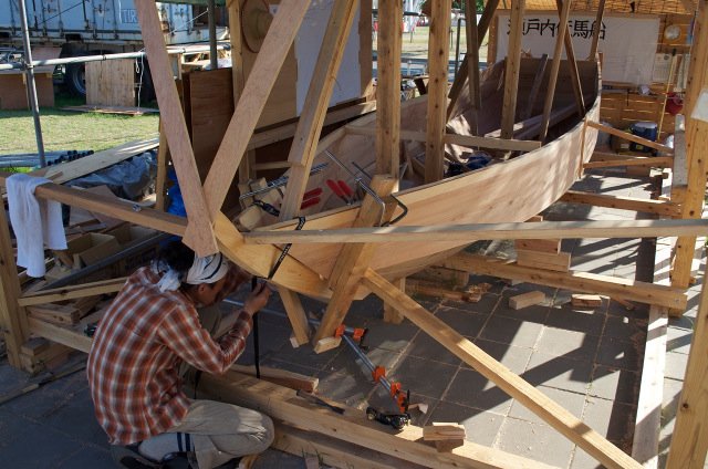 Clamping and propping both sheer planks in place prior to fastening.