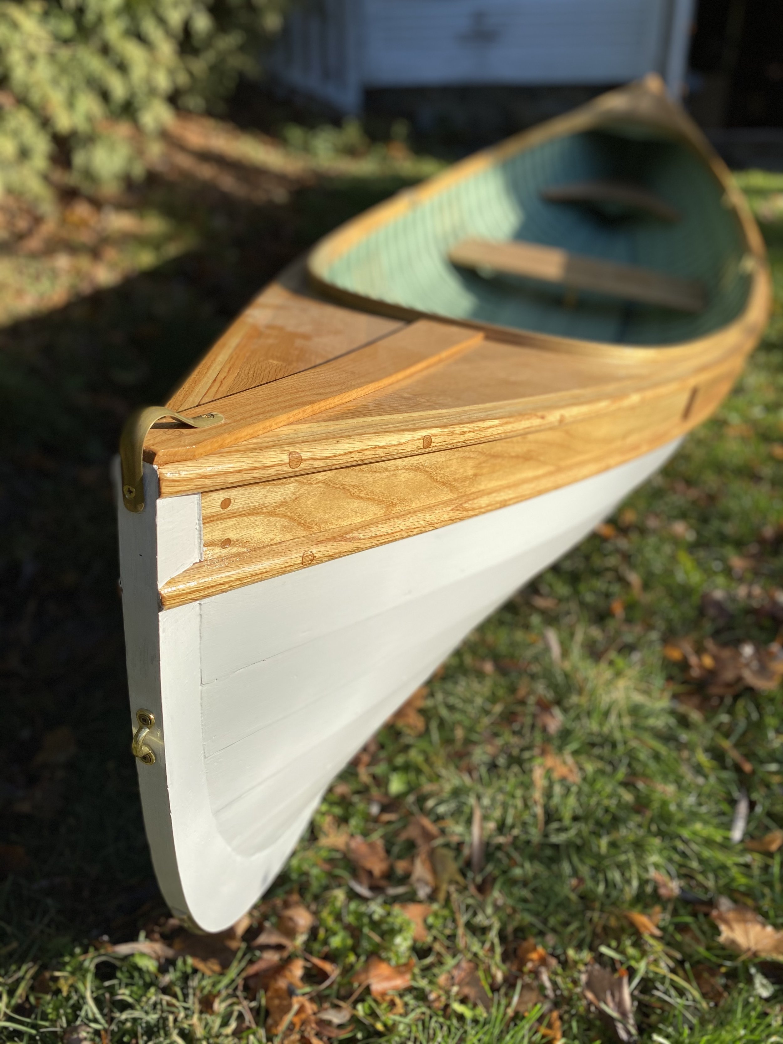 Sheer, decks, coamings, and thwarts finished with varnish.