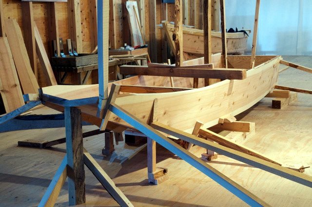 The whole assembly is propped in place. Here the planks are being bent to shape.