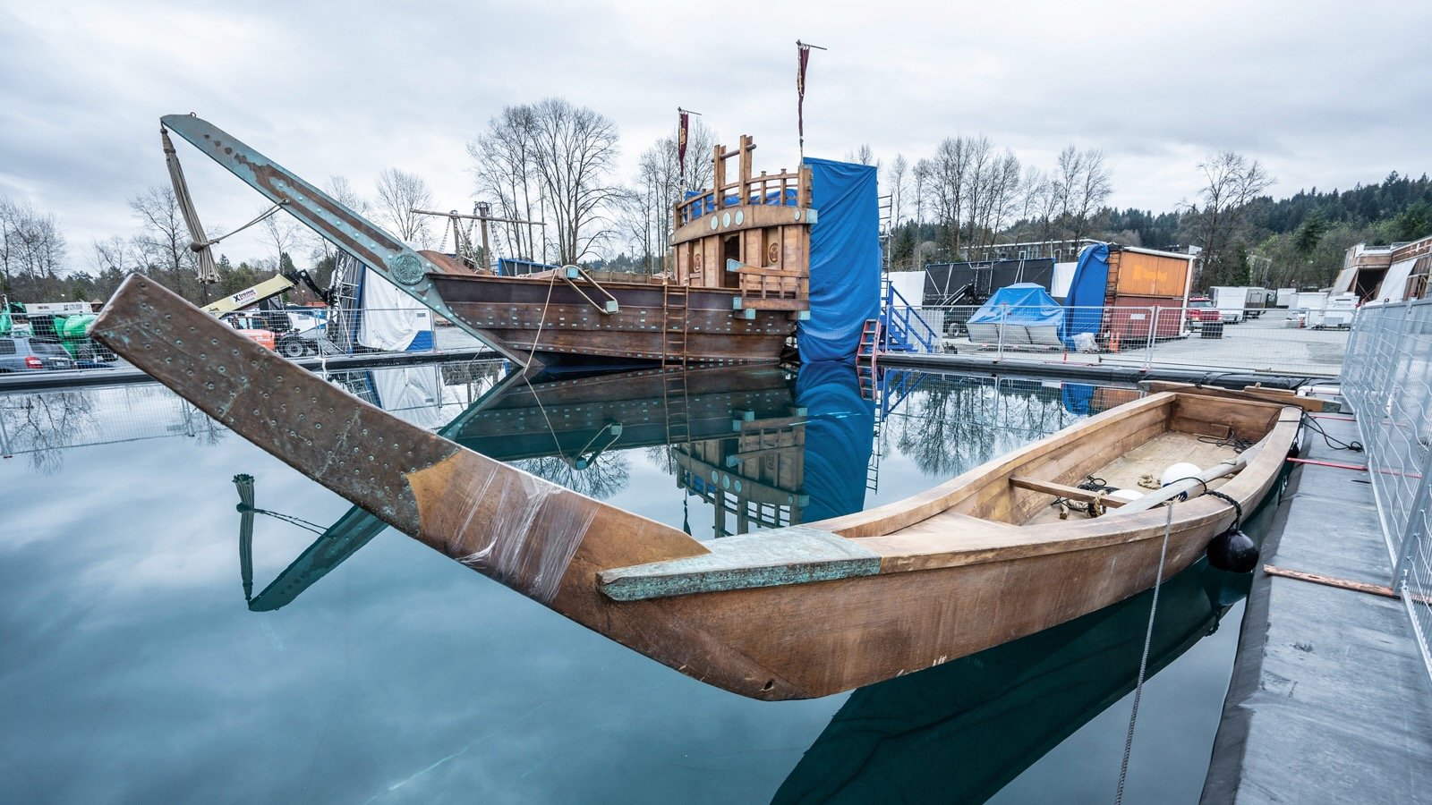 In the background a partial warship mounted on a barge and pushed by a tug for shooting scenes using computer generated images for the background. (Dean Eilertson)