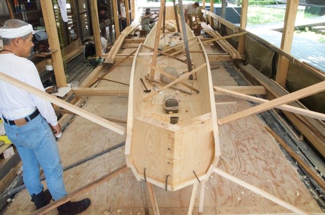 Planks propped in place and large stones were placed inside to hold the assembly in place.