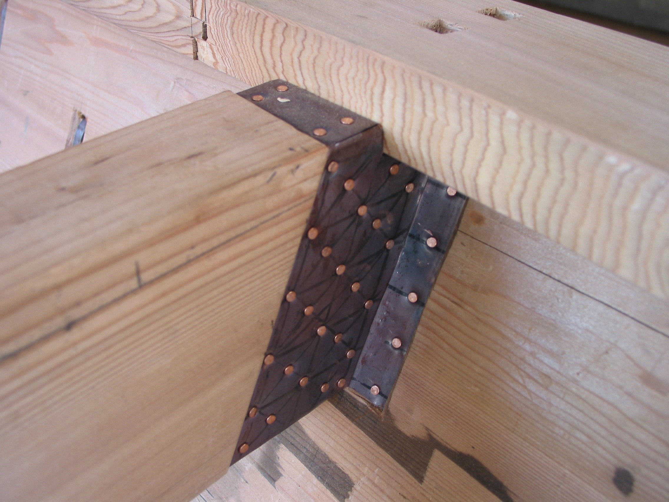 The joints covering the beam/plank connections were covered in copper.