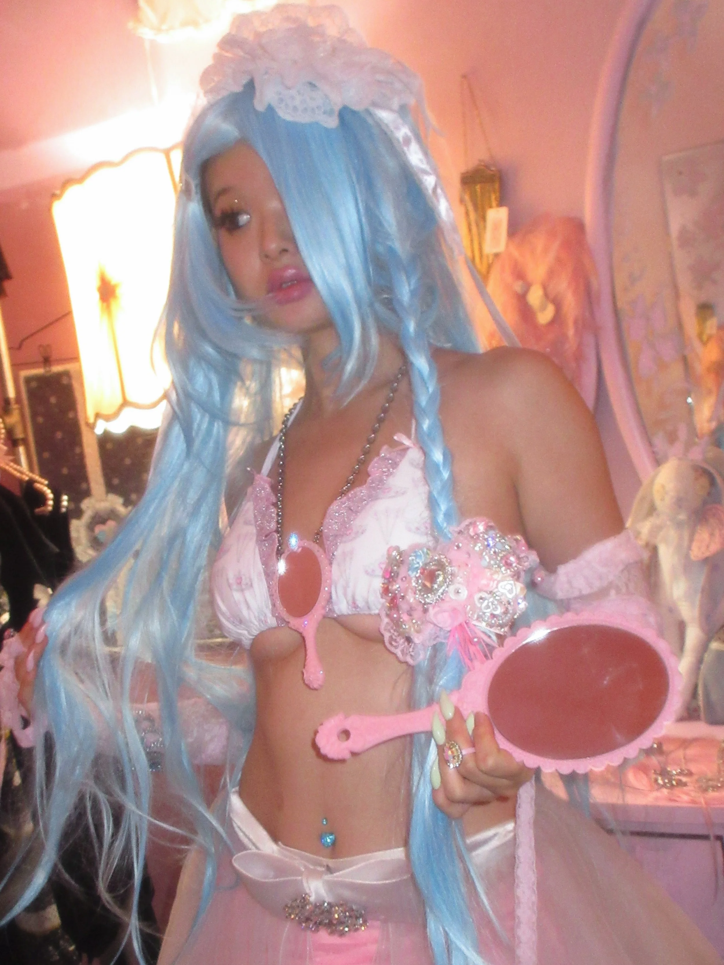 Romie in the tiara ruffle bikini, aqua tiara cuff and the pink mirror necklace 

Styled by @le_jes and shot in @venusintokyo