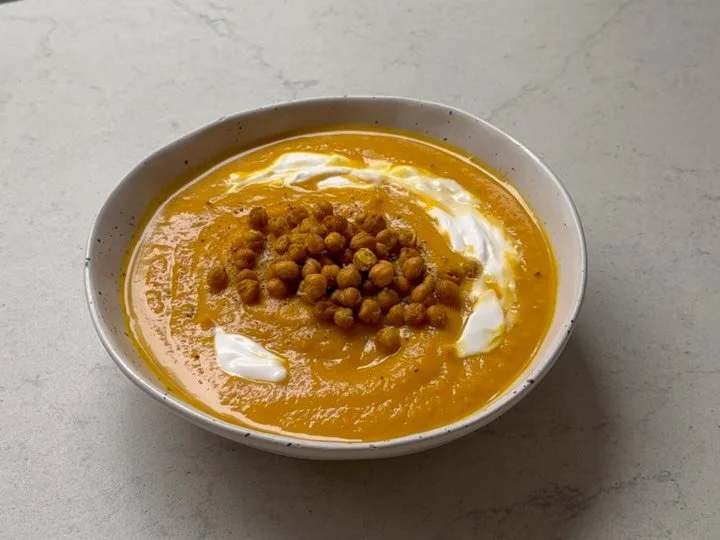 coconut pumpkin soup &mdash; my all time favourite

there is something deeply regulating about a warm, nourishing bowl of soup. the act of making it - the smell of ginger and garlic hitting coconut oil, the sound of a gentle simmer - is almost as the