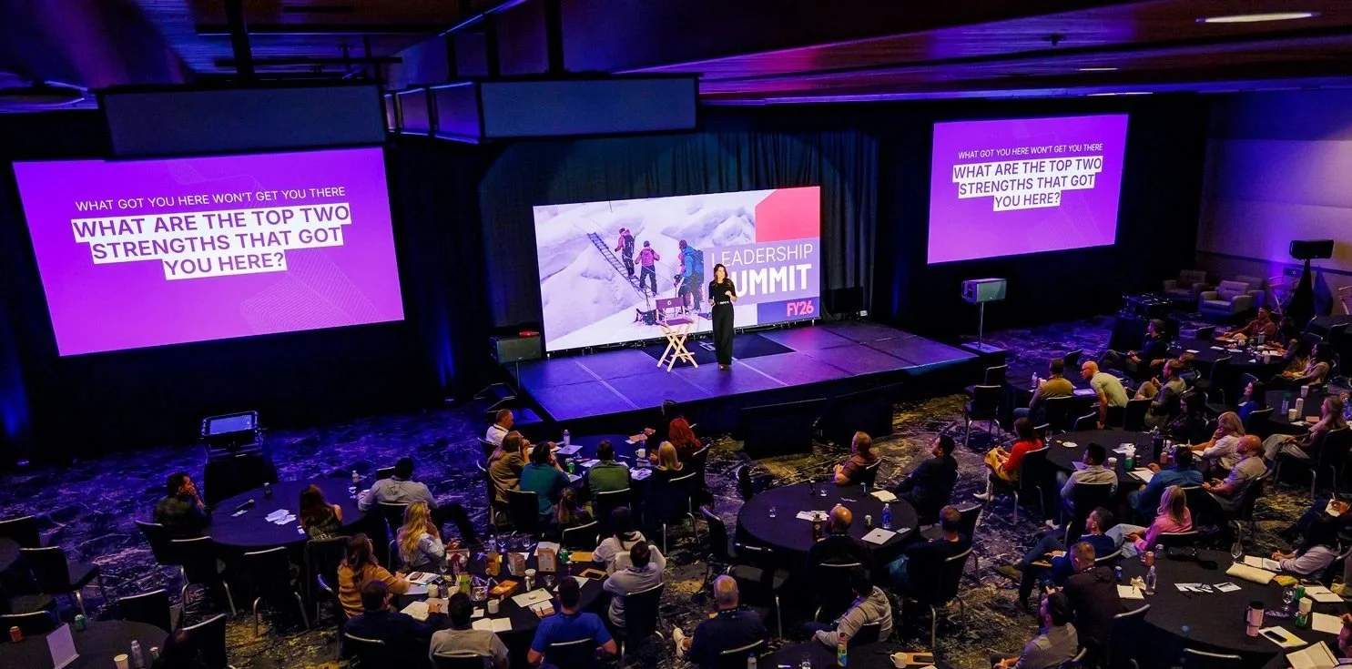 Large General Session Main Stage, Projectors, LED wall, keynote speaker. 