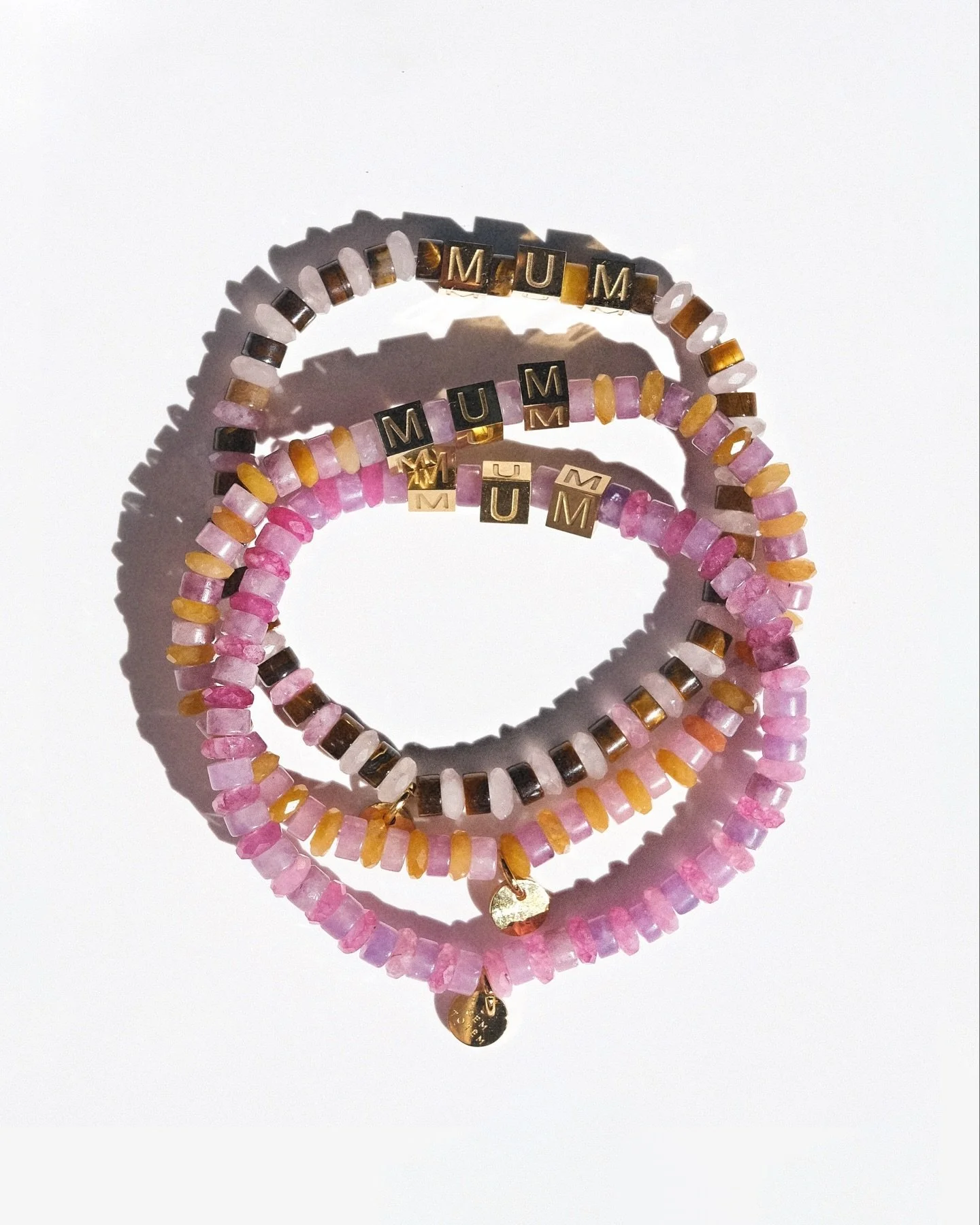 Our Mother&rsquo;s Day limited edition stretchy bracelets with gold-plated MUM letters &ndash; a tribute to mothers in all forms.

Jasper &amp; tourmaline, tiger eye &amp; quartz, or jasper &amp; jade &mdash; choose your palette.

One size. Water-fri