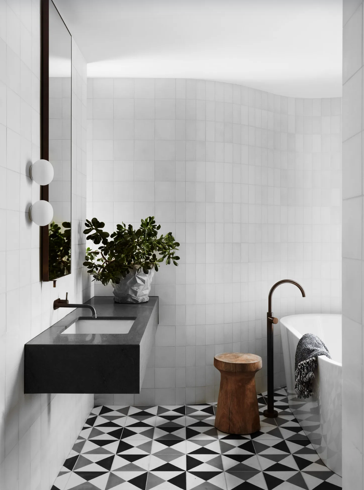 Black and White Bathroom with A Curved Wall