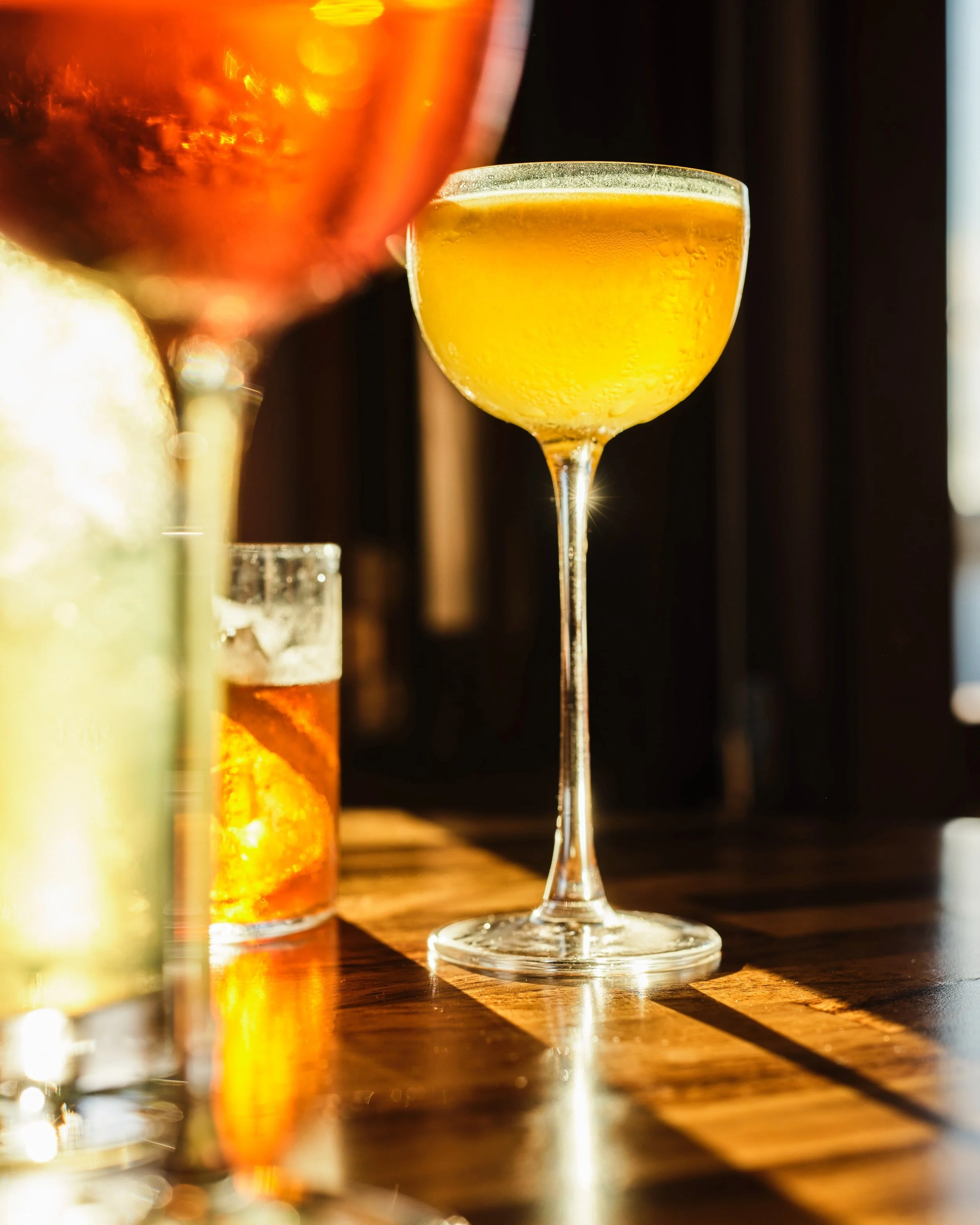 Sunny cocktails Upstairs at Madalena's all weekend.