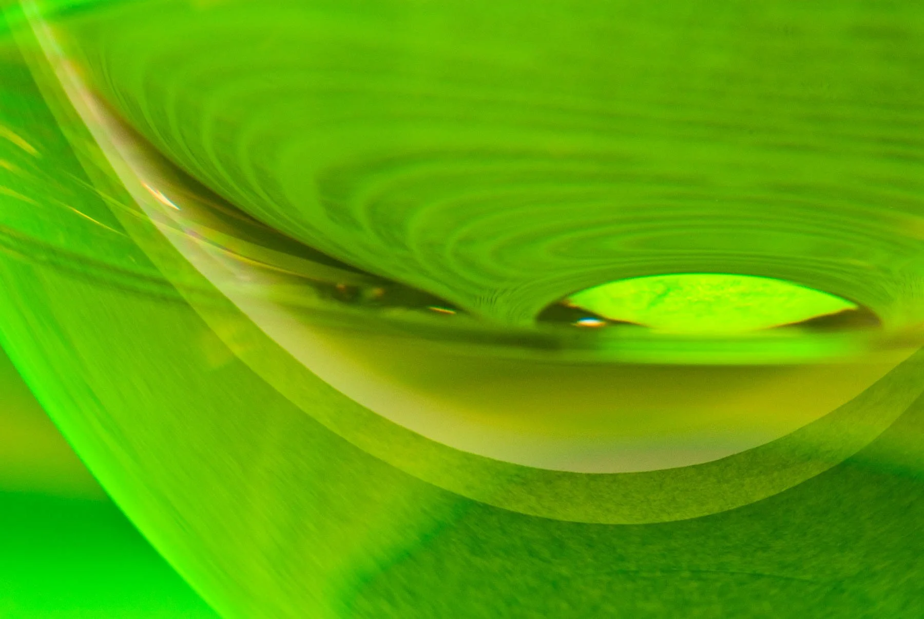 Reflection of a wine bottle in wine glass captured by Raj Sarda Photography