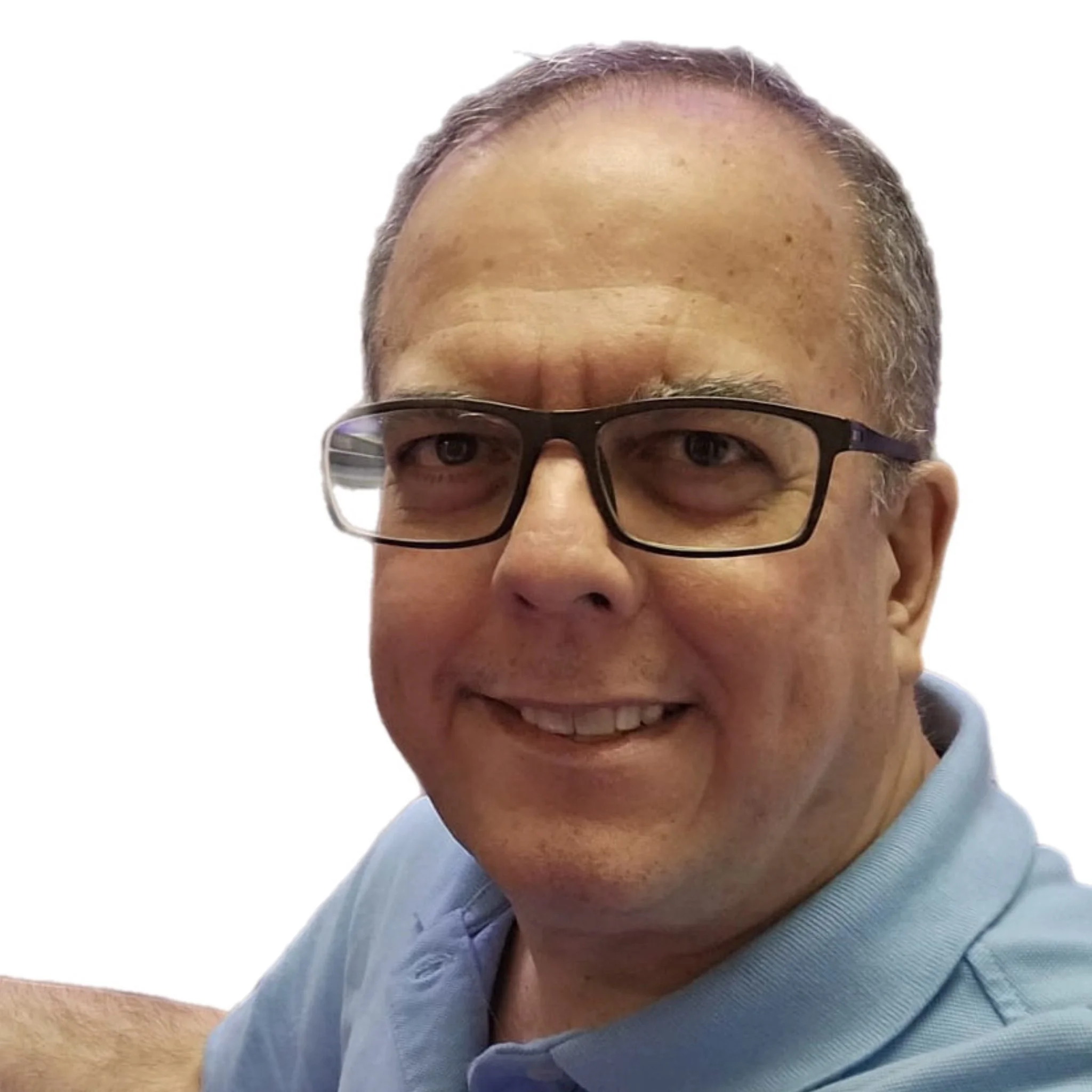 A man wearing glasses and a light blue polo shirt smiling at the camera against a white background.