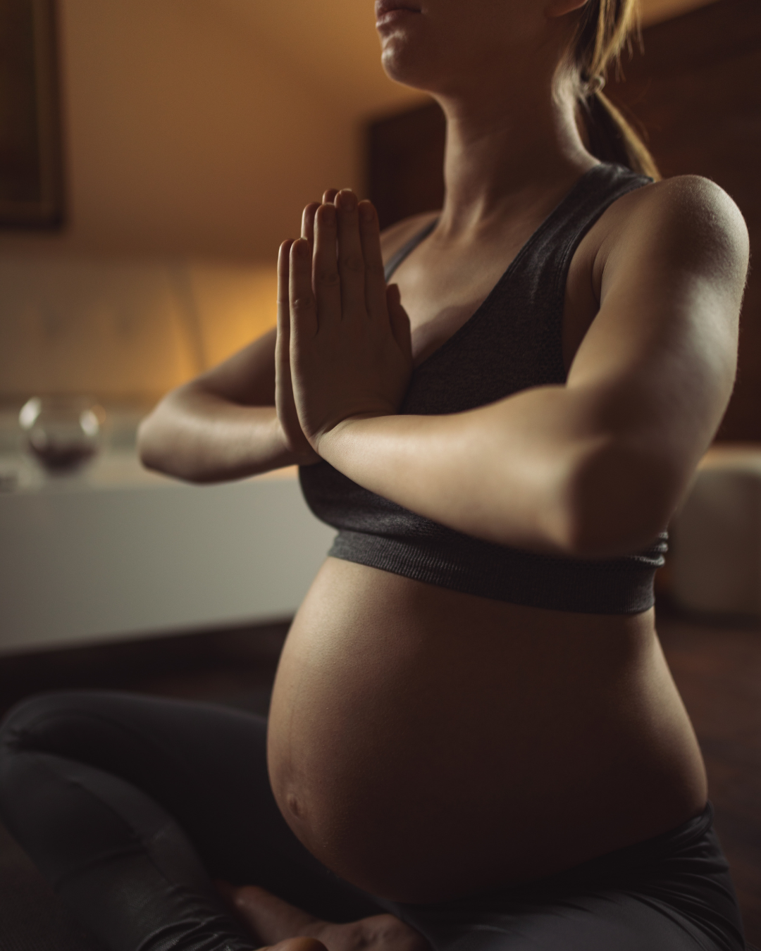 a pregnant woman practicing yoga