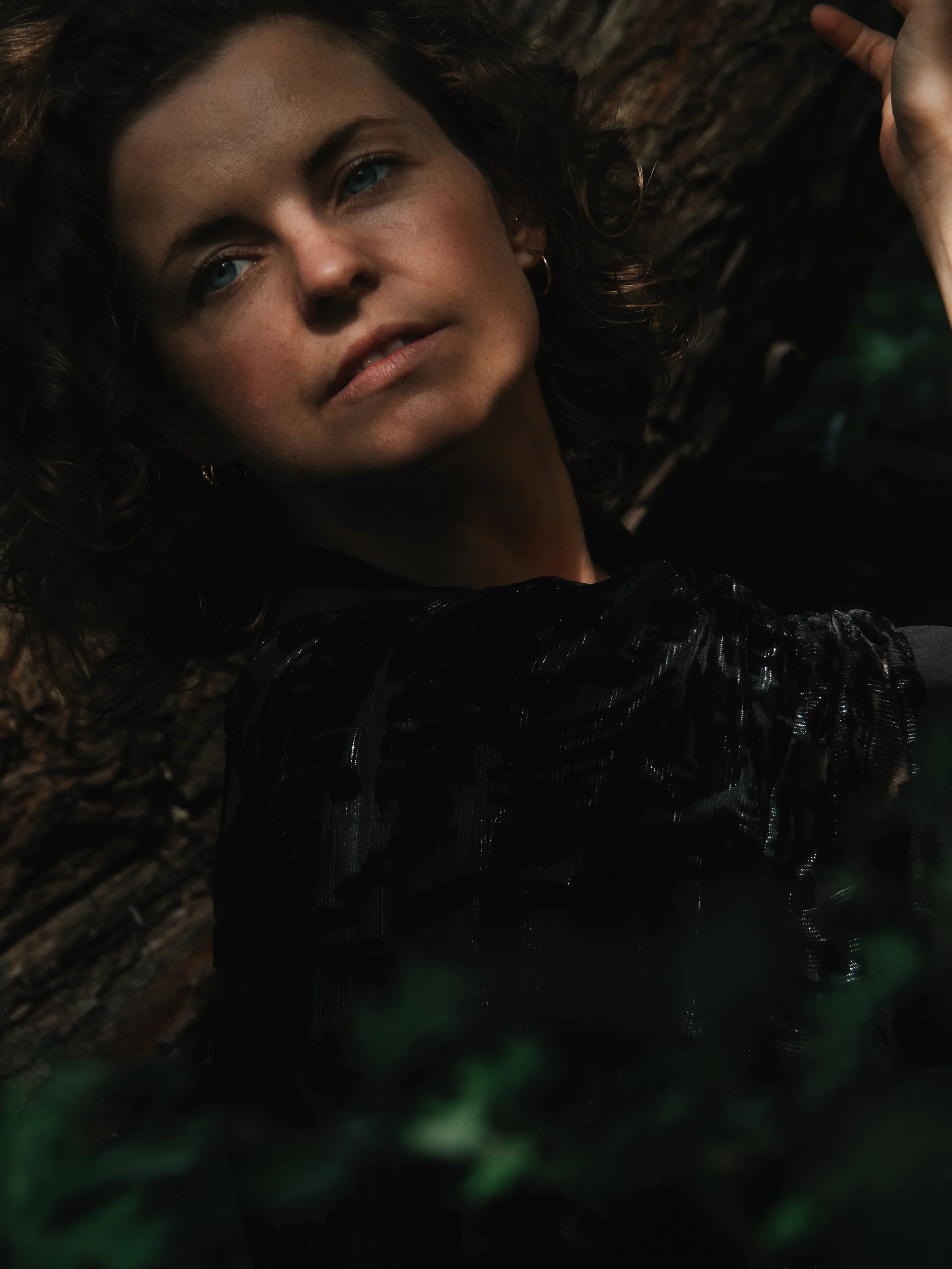 Black and white portrait with raised arms