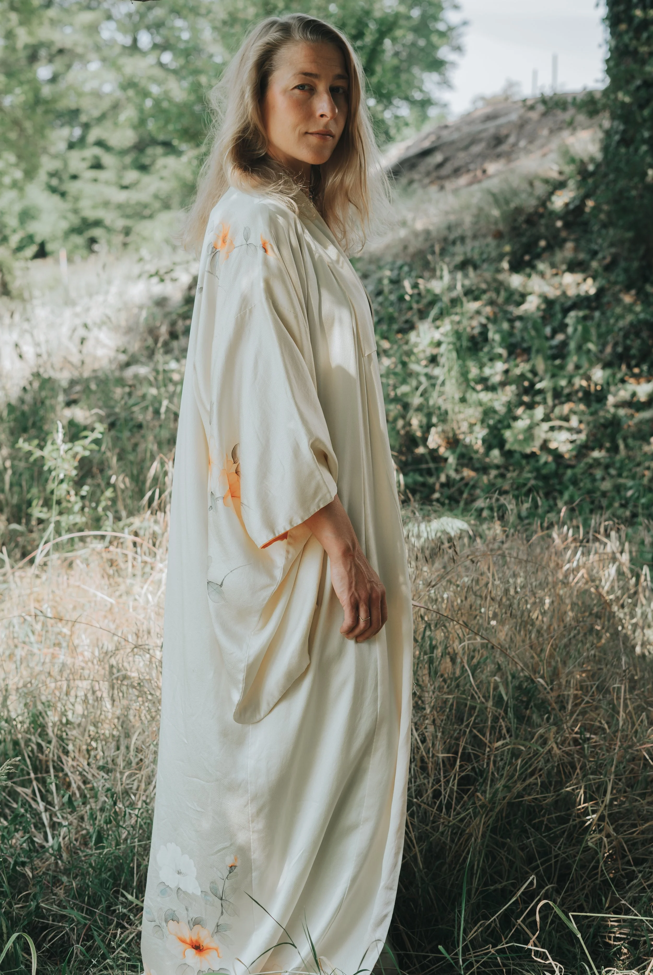 Woman in a white dress in a meadow