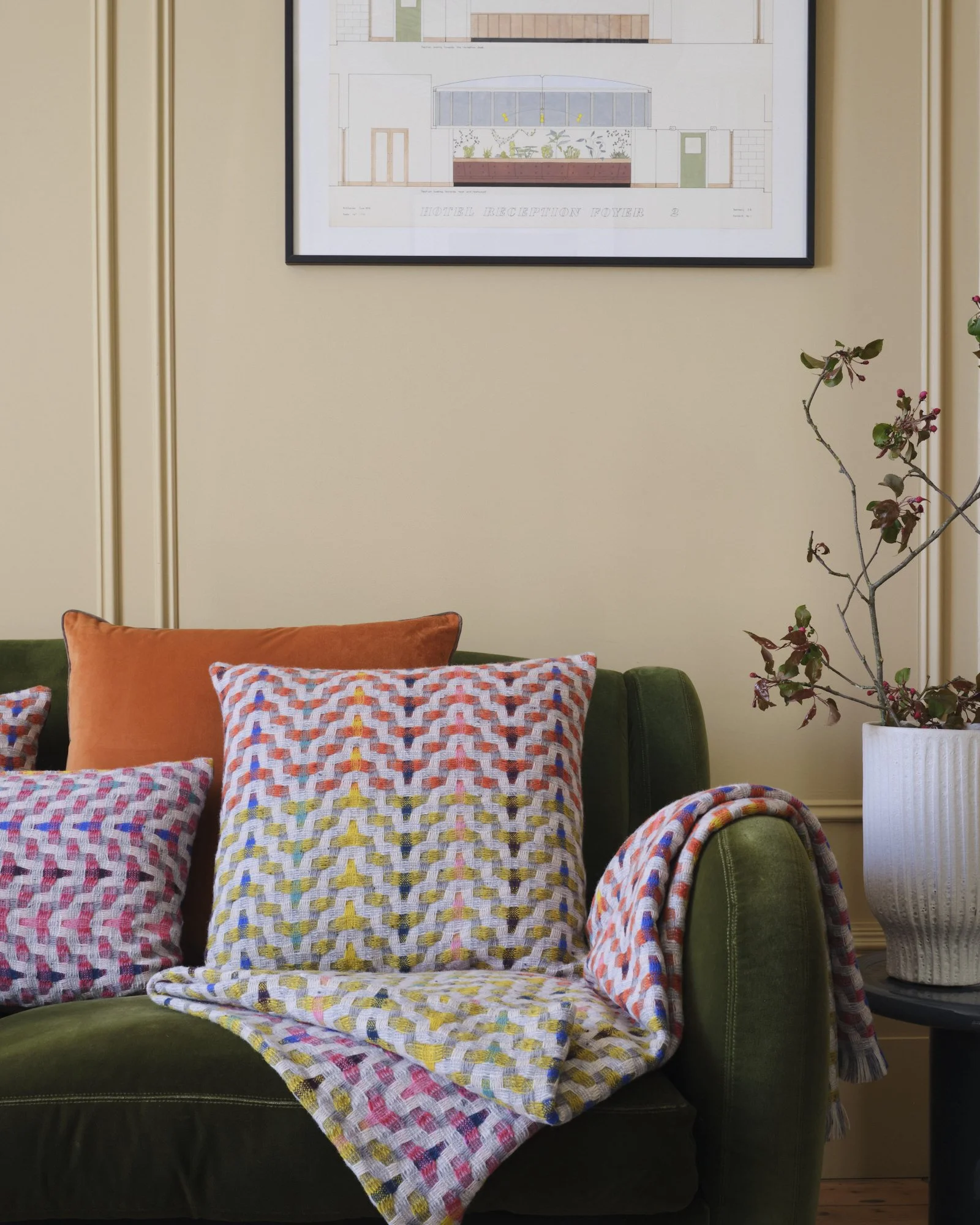 Bonnie_Kirkwood_Fuchsia collection on green sofa low res.jpg