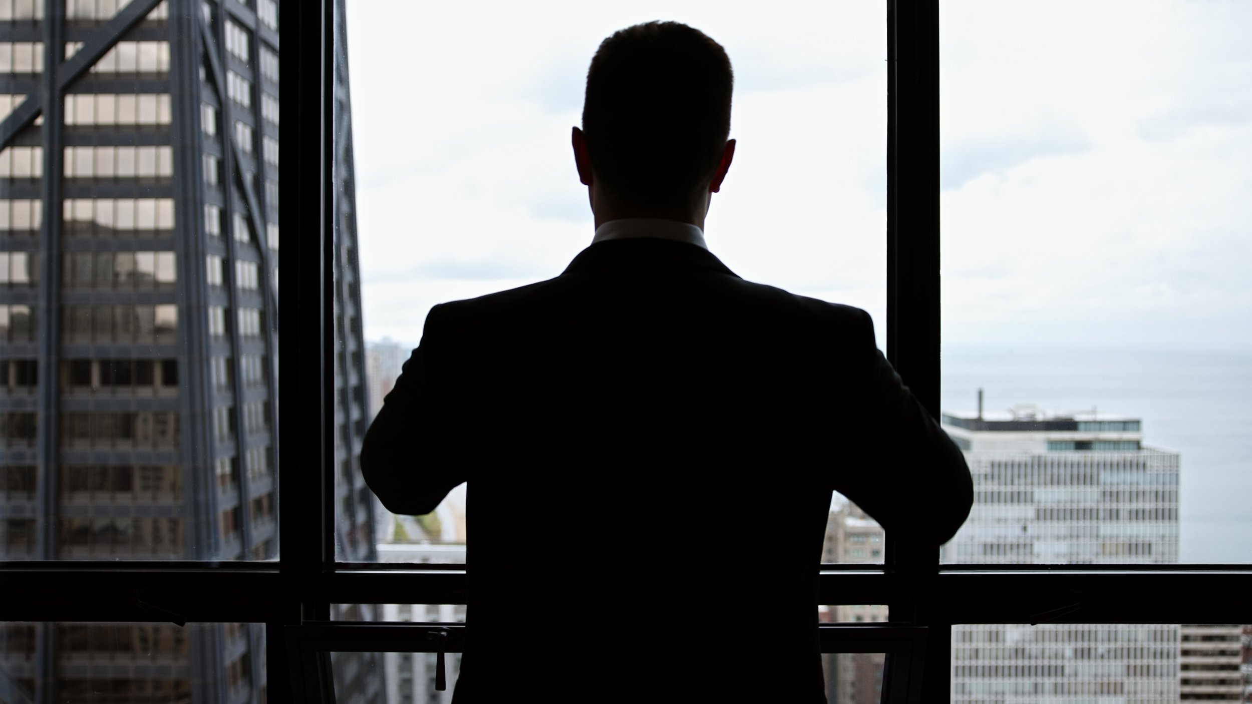 groom in window_1.59.1.jpg